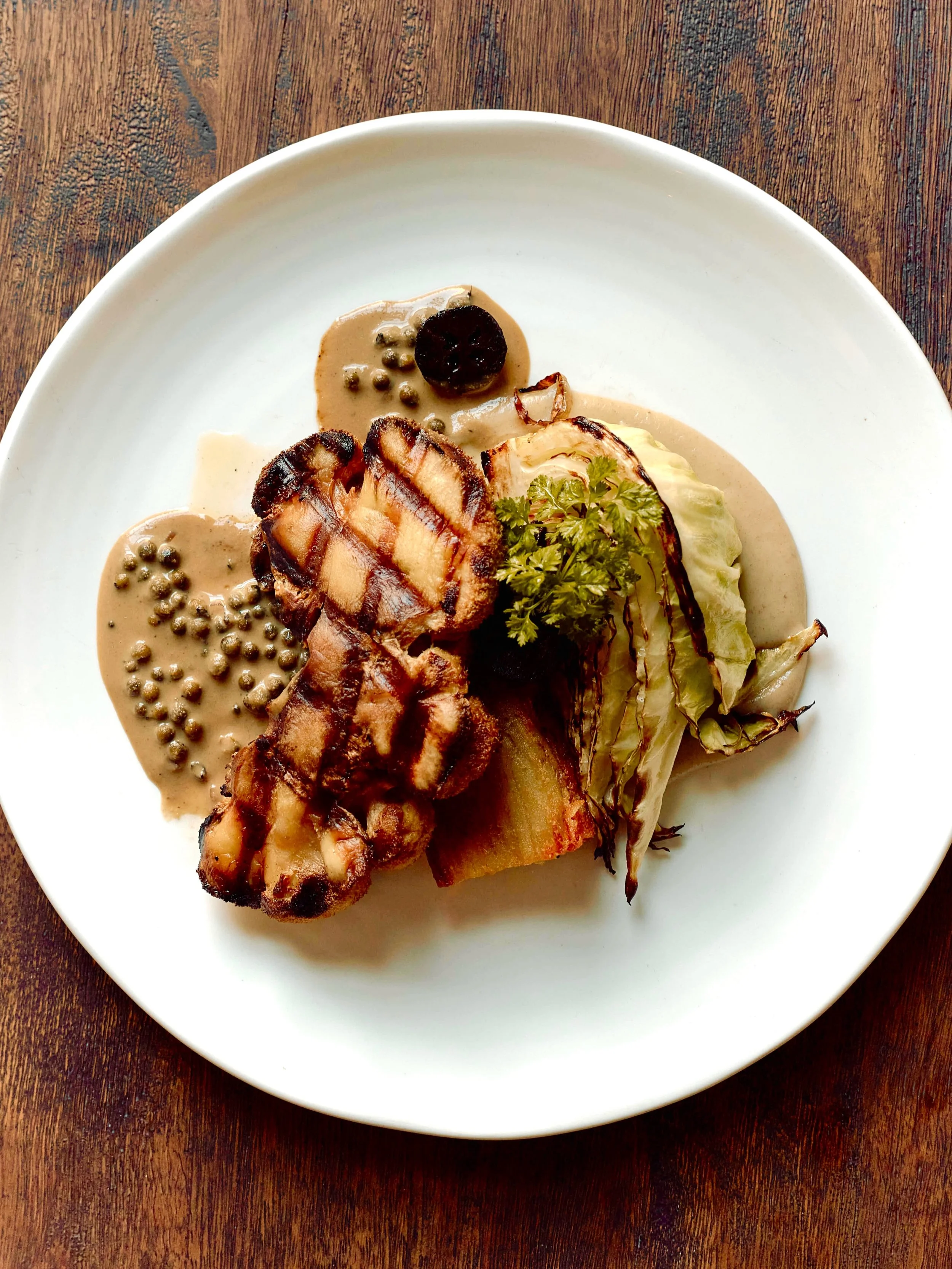 No mushy vegan food here! Seared Lion&rsquo;s Mane mushroom steak, with crisp Pommes Anna (layered potatoes), caramelised sugarloaf cabbage, Jerusalem artichoke, pickled walnuts, and a cashew peppercorn sauce to bring it all together.

Crisp, creamy,
