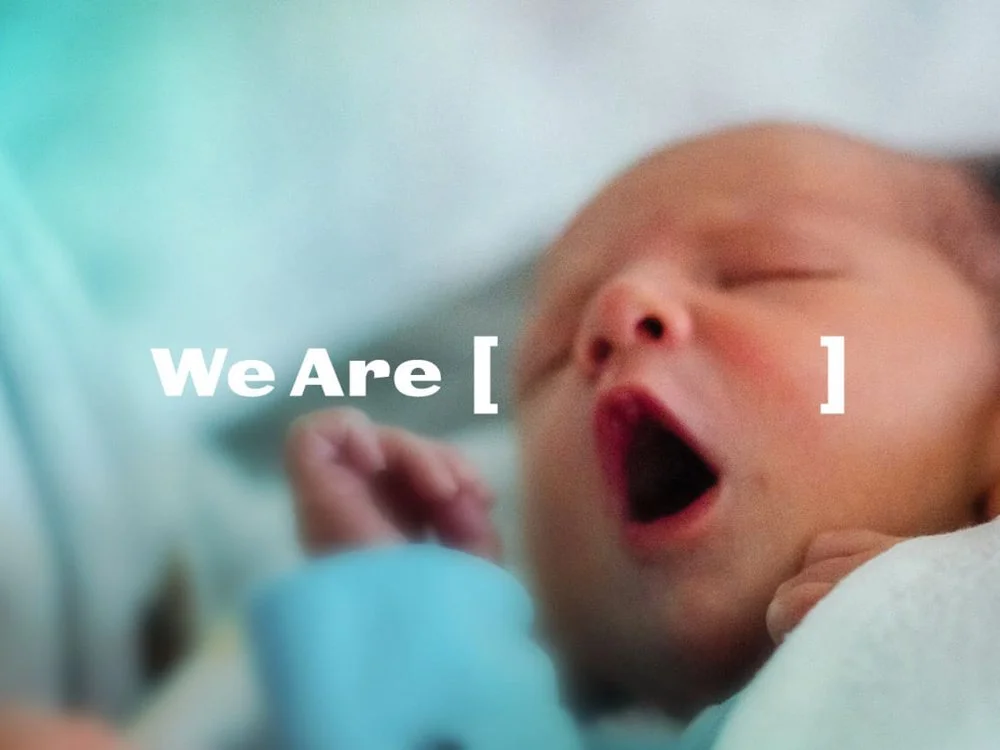 We Are logo with baby image