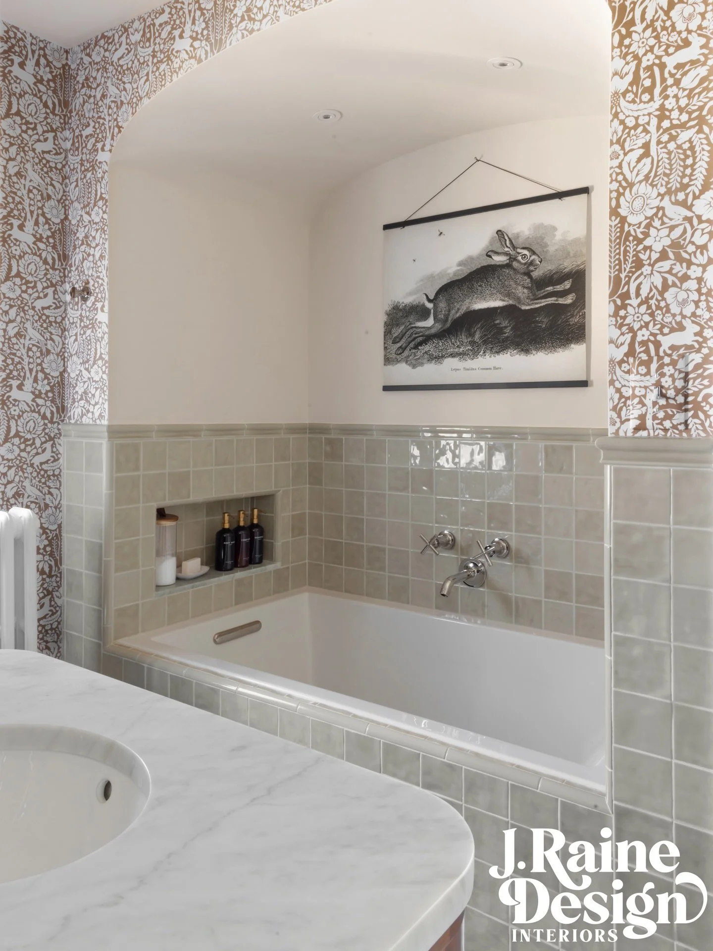 Jack + Jill Bath 🐇 // Grosse Pointe Park 
.
This bathroom originally did not have a tub. We were able to eliminate one of the closets in an adjacent bedroom and add in this arched space for a drop in tub. With the extra width, an extra deep niche wa