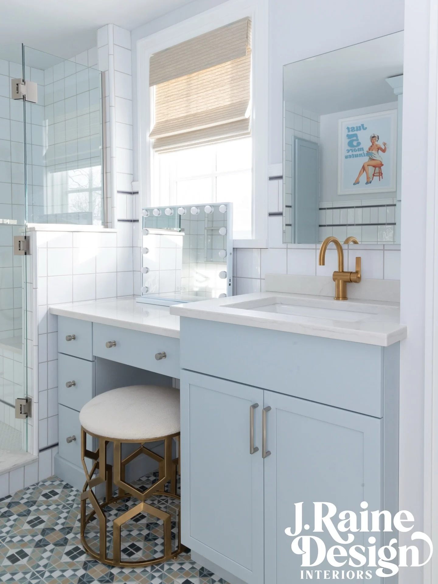 Girls Bath // Bloomfield Hills 
.
Another view towards the vanity + makeup counter - patterned floor tile, light blue cabinetry, + a woven cordless Roman shade