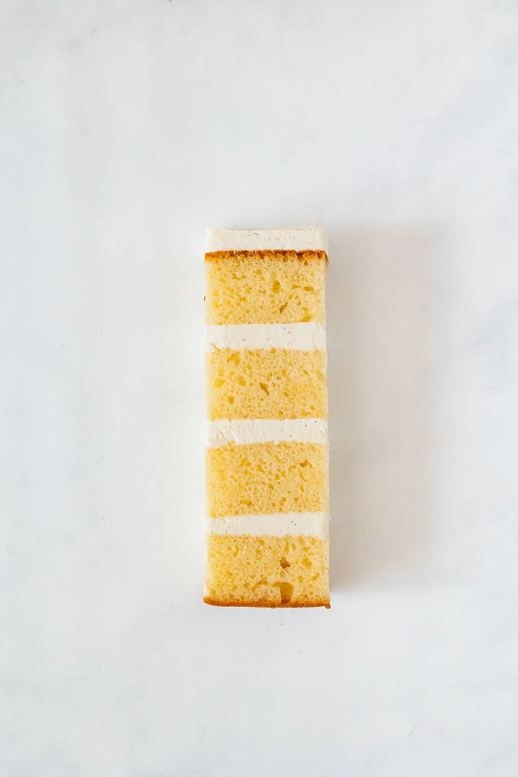 slice of vanilla cake wth vanilla buttercream