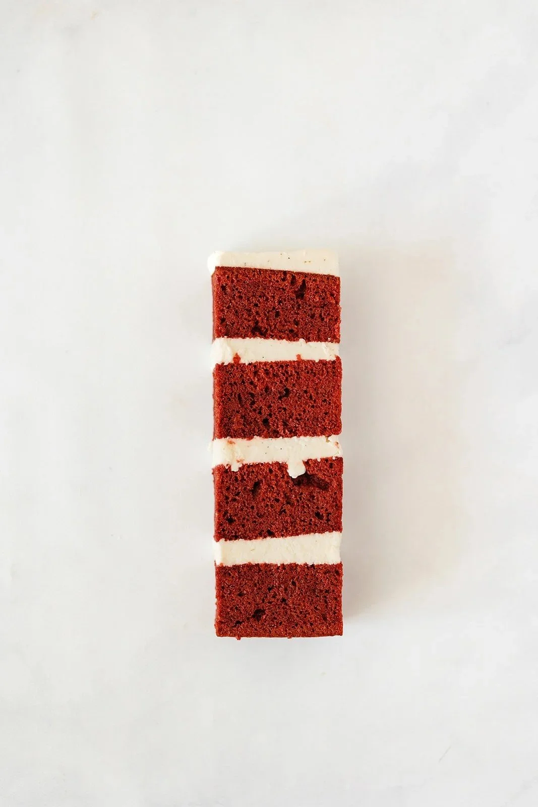 slice of red velvet cake with cream cheese buttercream