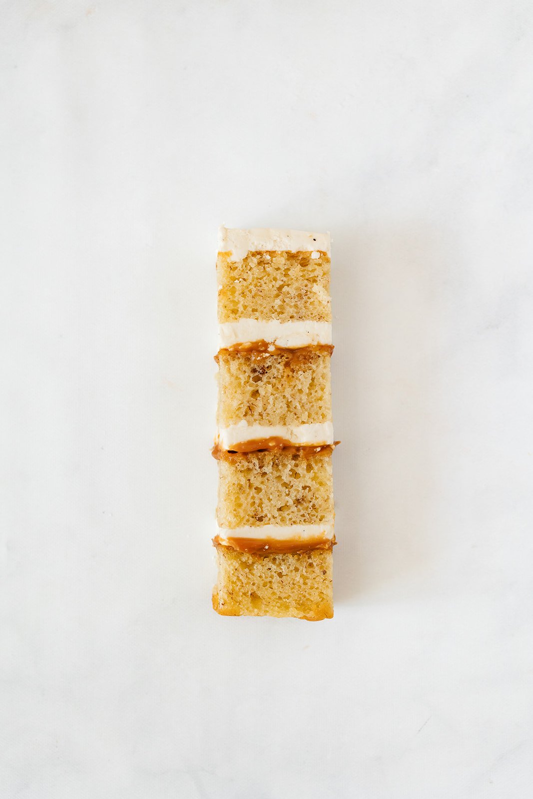 slice of banana cake with caramel and vanilla buttercream