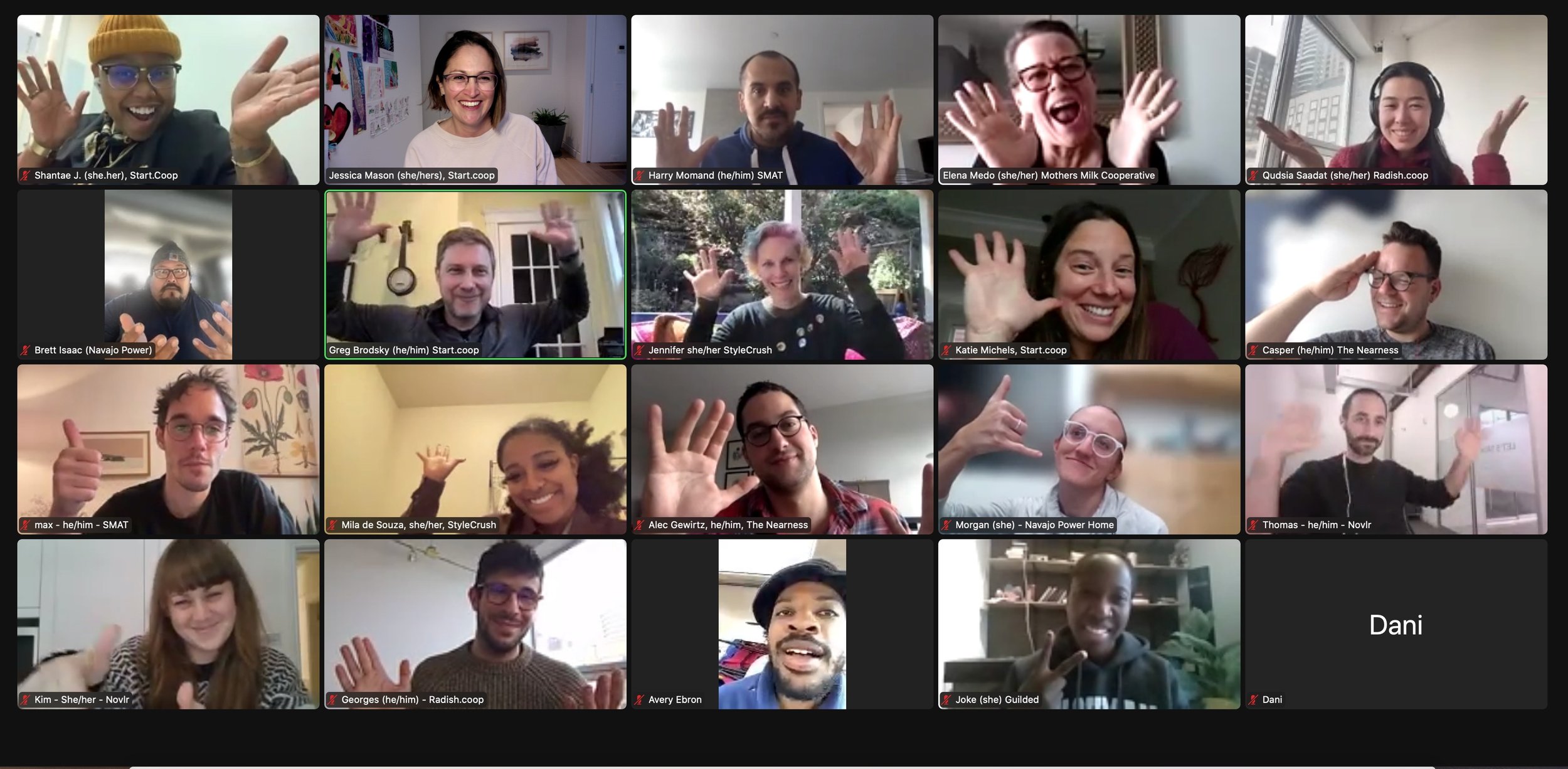 Online video meeting with multiple participants waving at the camera in a grid layout.