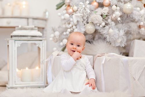 Baby at Christmas all in White.jpg