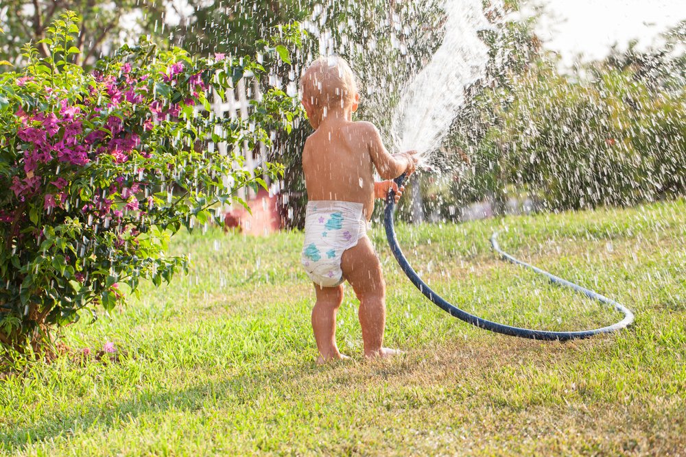 Baby with Hose.jpg