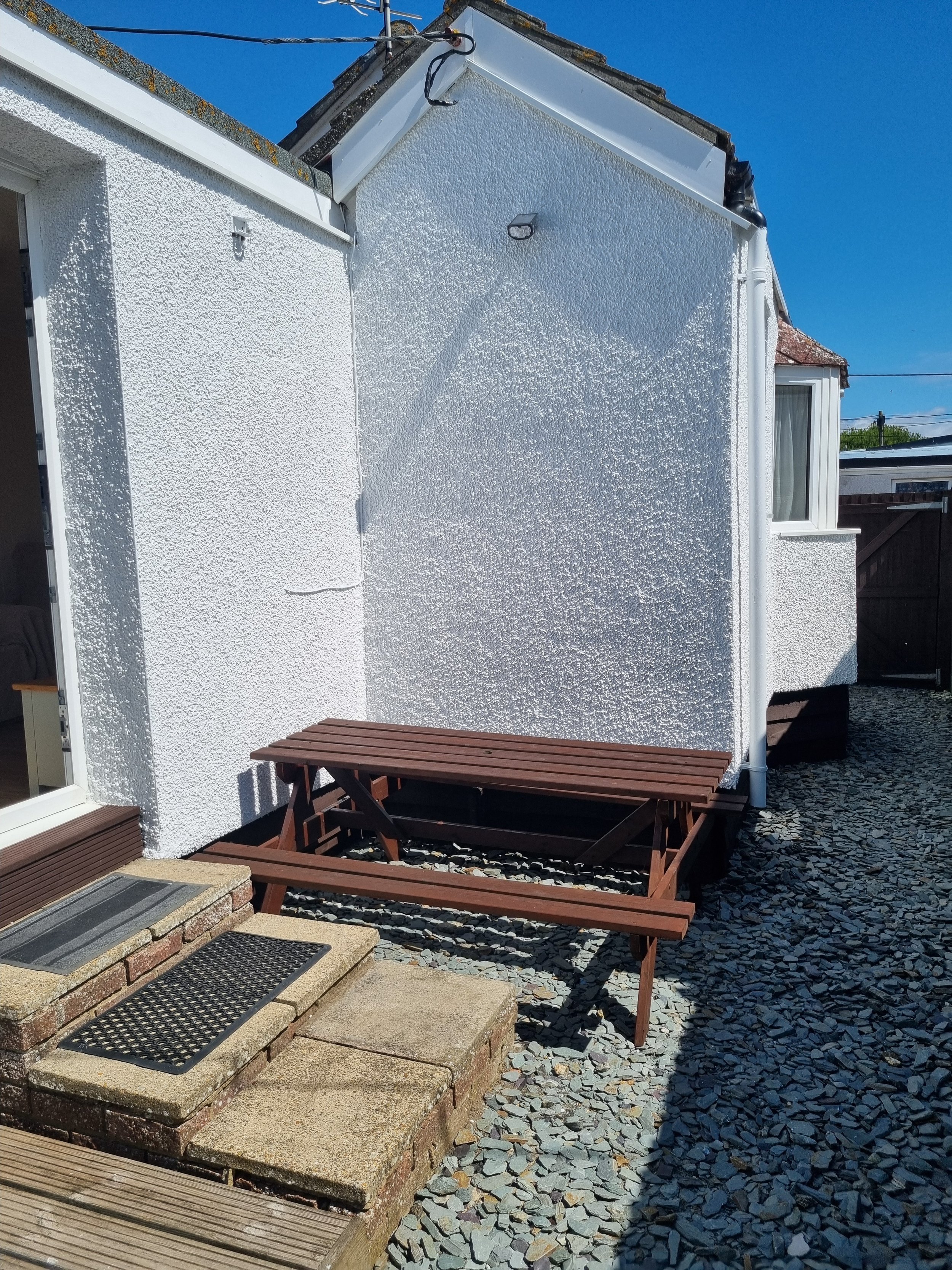 A second bench table by the back door. 
