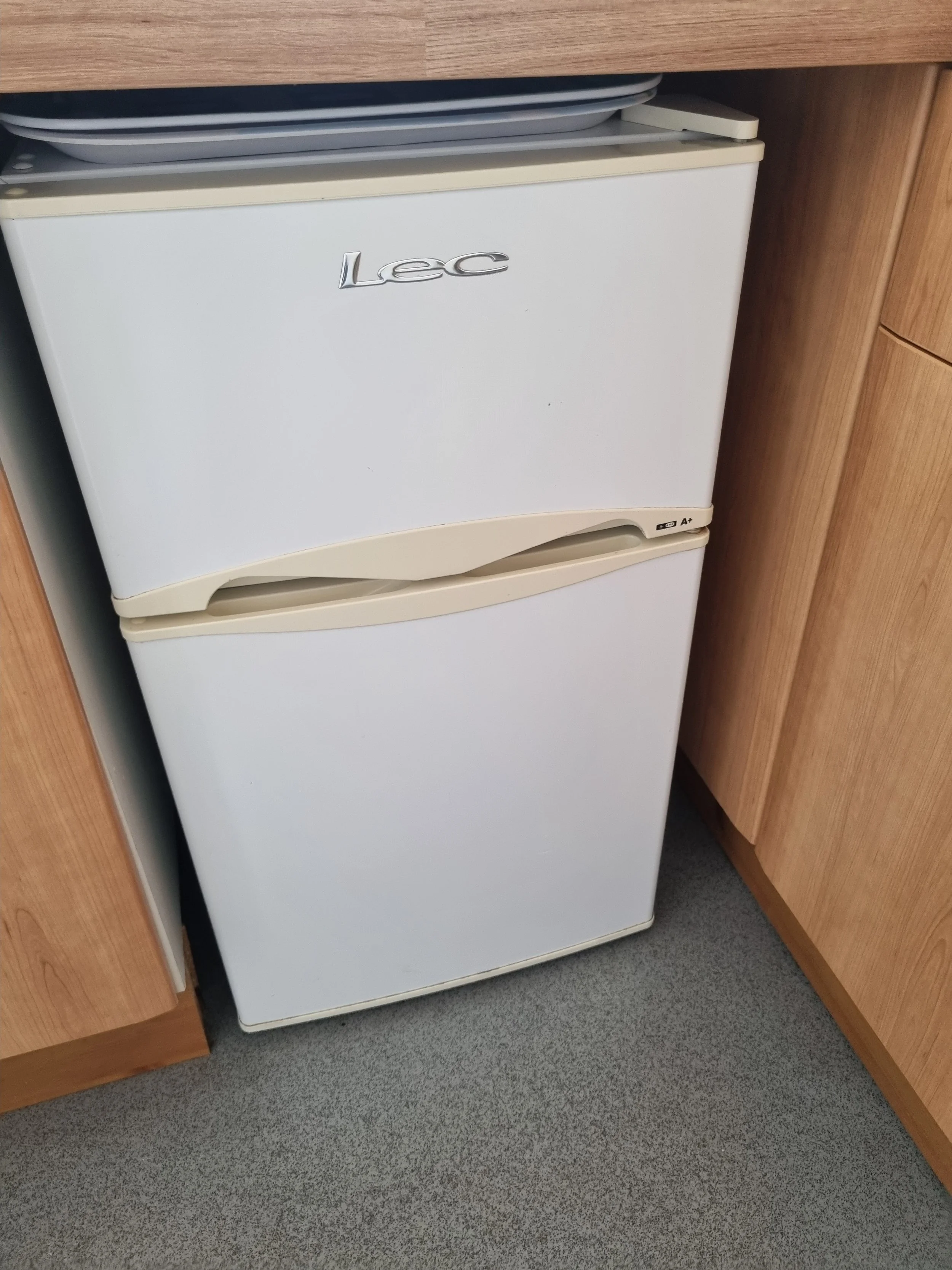 Fridge with freezer compartment over