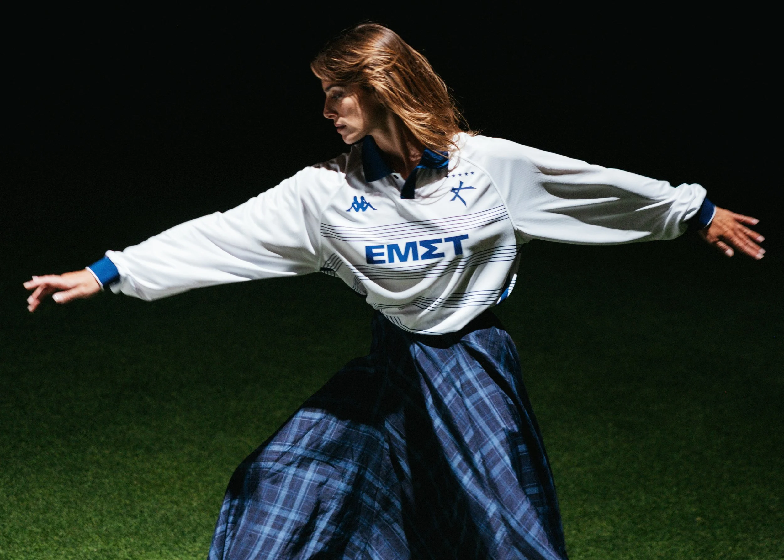 Woman dancing wearing an Athens Kallithea jersey