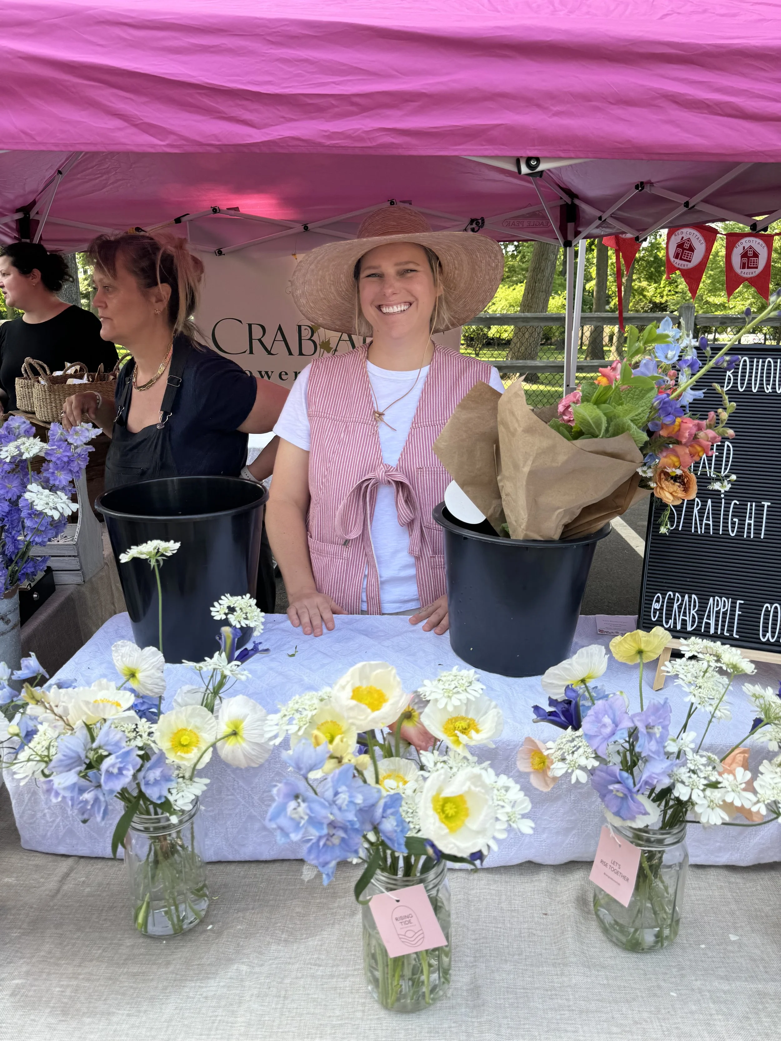 Taylor Barry at the local farmers market with spring bouquets in Fair Haven, New Jersey