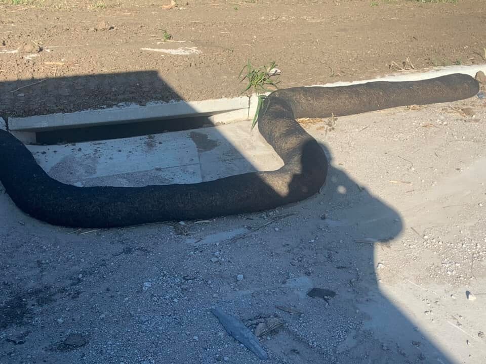 etube erosion control filter sock installed on project to protect an inlet.