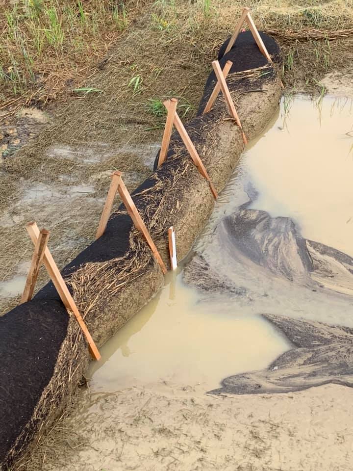 etube filter sock installed as a ditch check on a project used to pond runoff as sediment is filtered out.