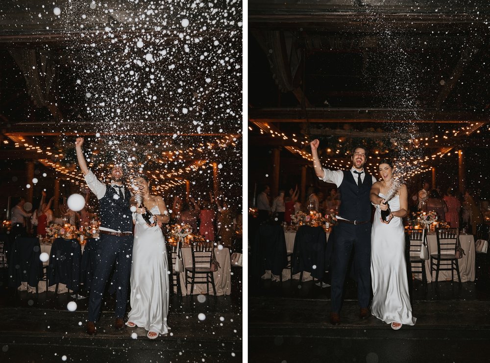 Bride and groom spraying champagne at their Niagara wedding reception