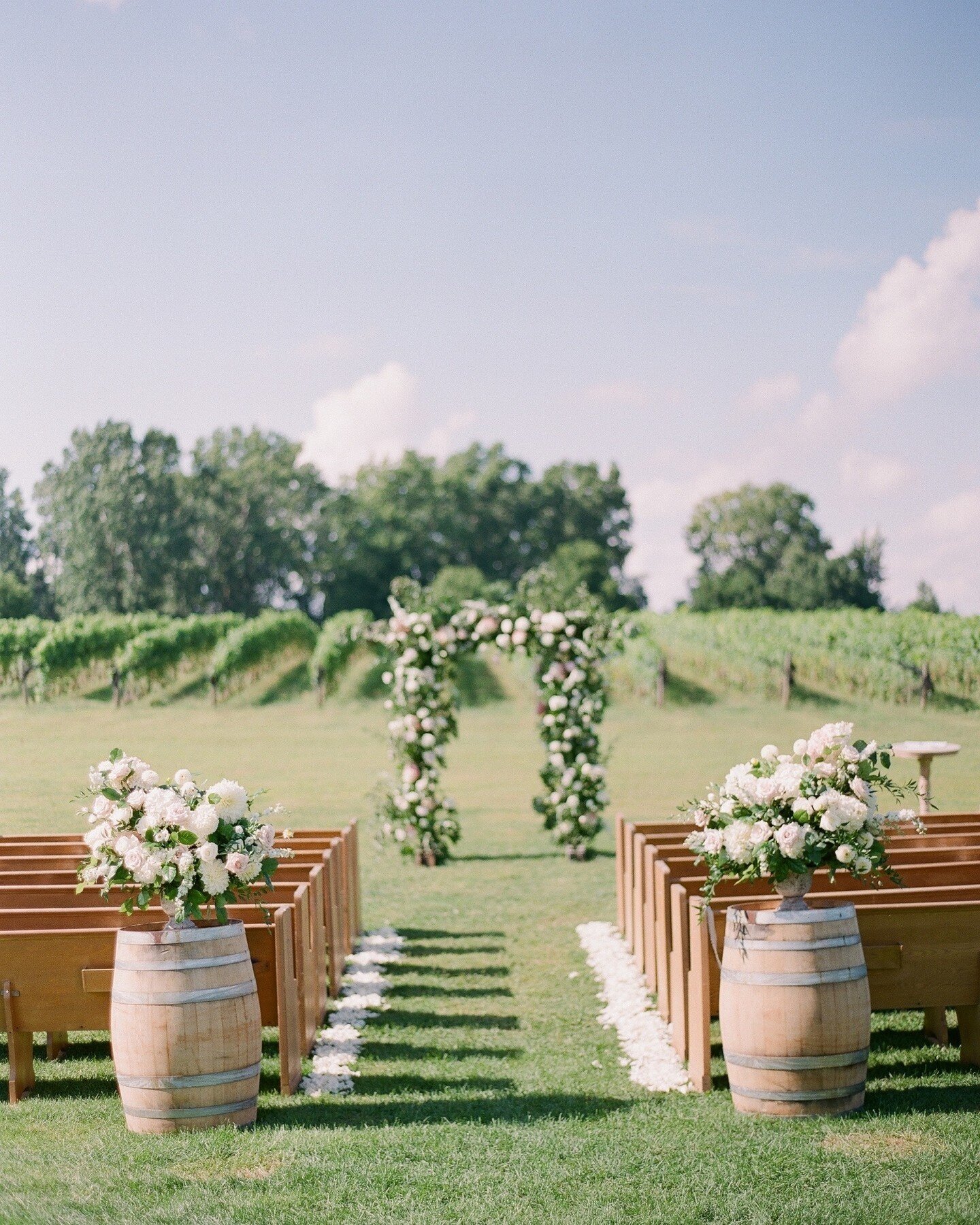 Let's talk about floral designs that will bring the punch of personality to your ceremony and up the ante for the rest of your overall wedding aesthetic: arches, arbours, and statement pieces. These are types of pieces that can be repurposed into you