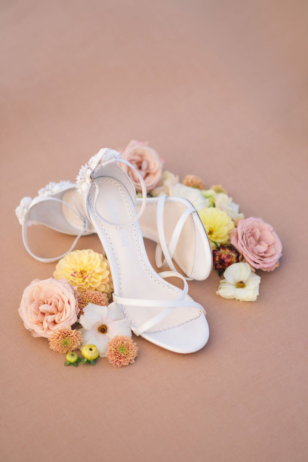 Bella Belle shoes with colourful fall florals in flat lay display, captured by Ugo Photography
