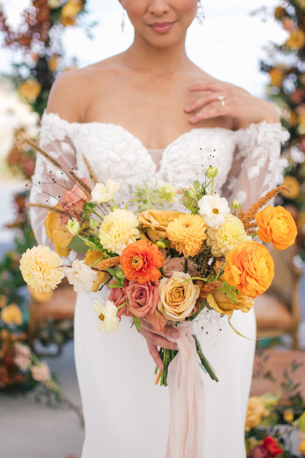 Fall wedding bouquet with custom lace gown from Stolen Hearts Bridal Boutique. 