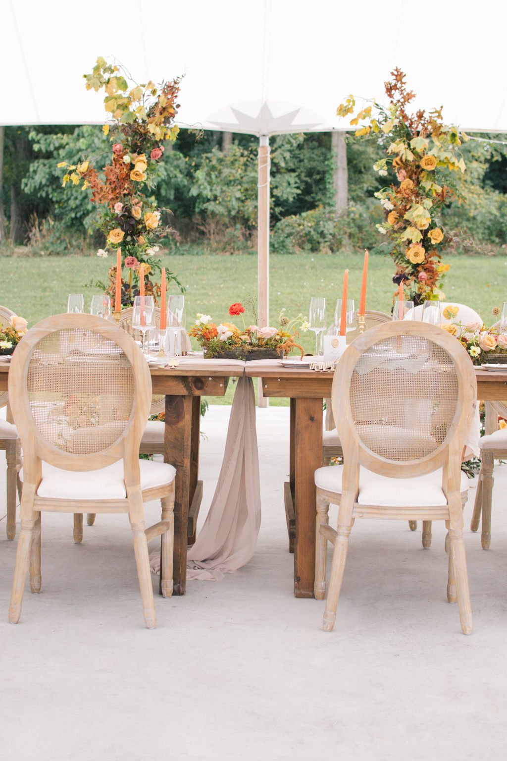 Sonoma wood chairs from Simply Beautiful Decor under the sailcloth tent at Wakefield Estate.