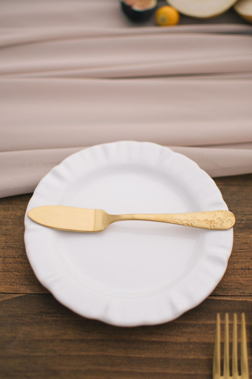 Gold floral cutlery from Simply Beautiful Decor on white tulle bread plate.