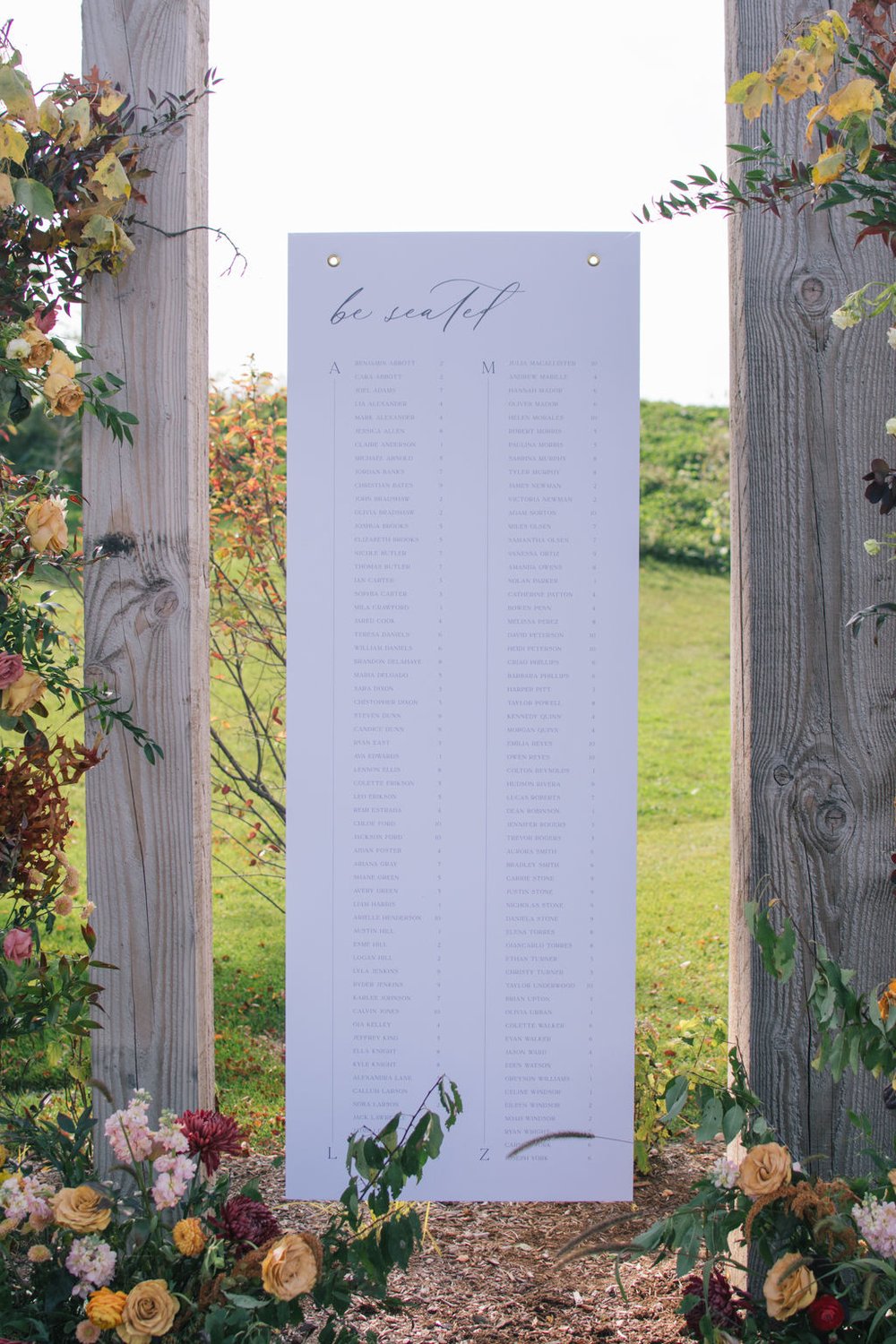 Hanging wedding seating chart to compliment the outdoor space at Wakefield Estate.