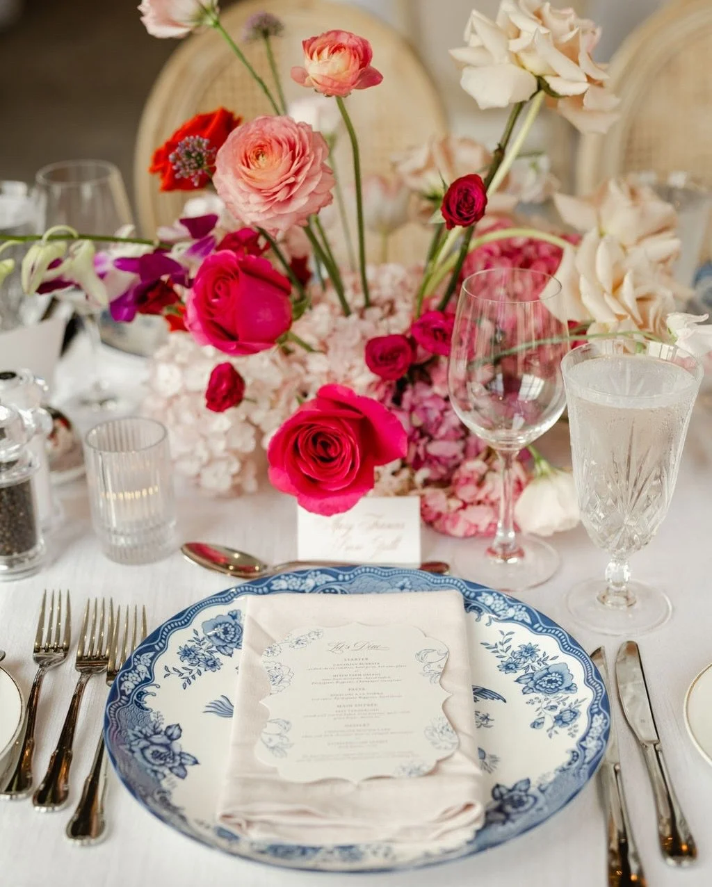 An August wedding at Elora Mill layered in richness and romance. Deep crimson and soft blush florals intertwined with sculptural blooms, warm candlelight, and timeless tableware created a design that felt both bold and beautifully balanced. 

Every d