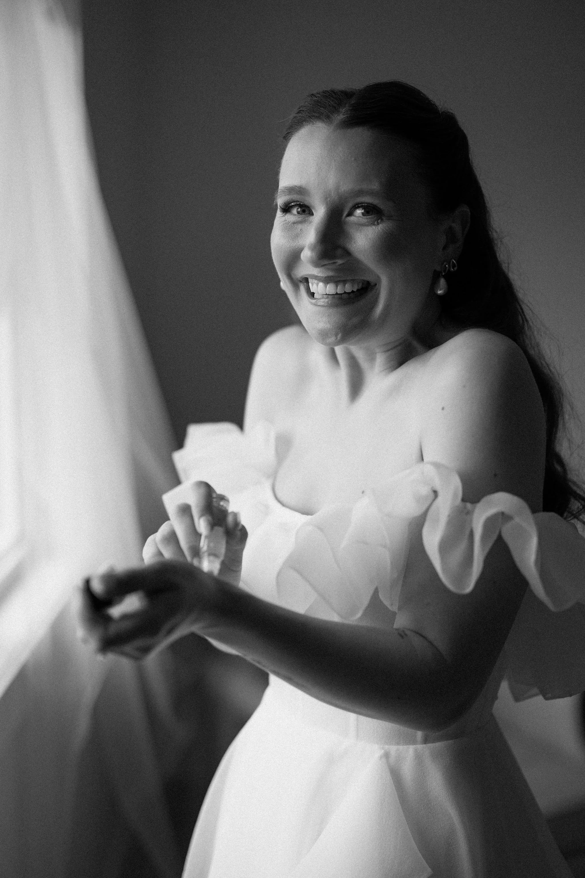  Cheerful bride getting ready for her wedding party for her tented wedding at The Clearing, Sheddon, Ontario. 