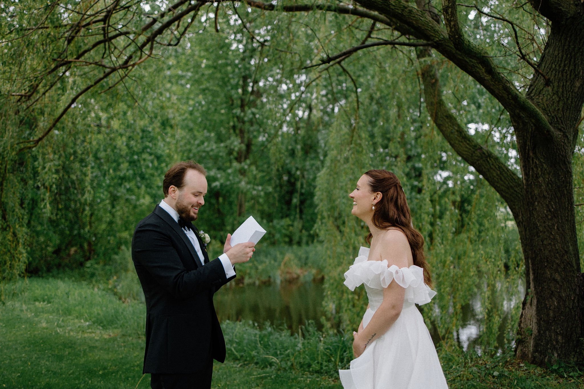  An intimate moment shared between bride and groom at their private vow reading before their ceremony at The Clearing. 