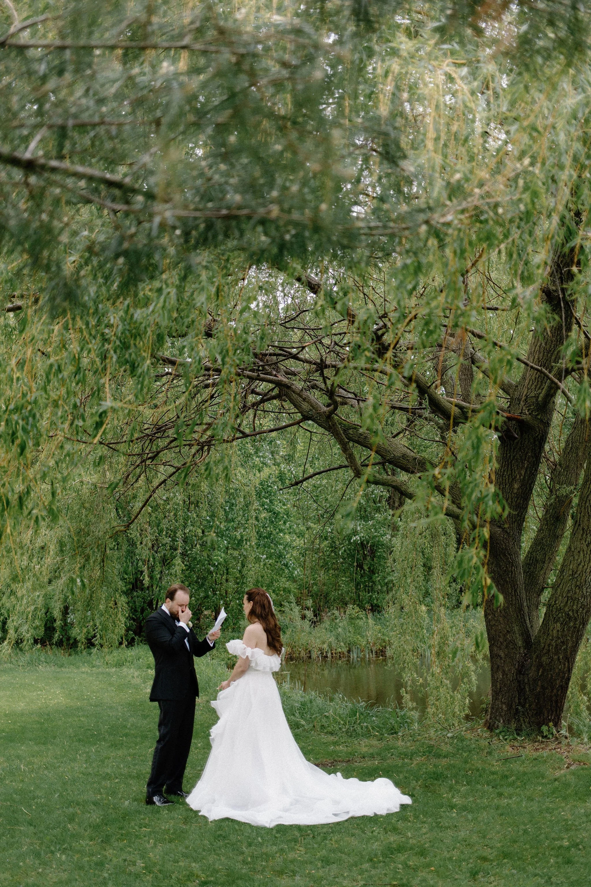  Private vows shared under the willow tree with the bride and groom at The Clearing. 