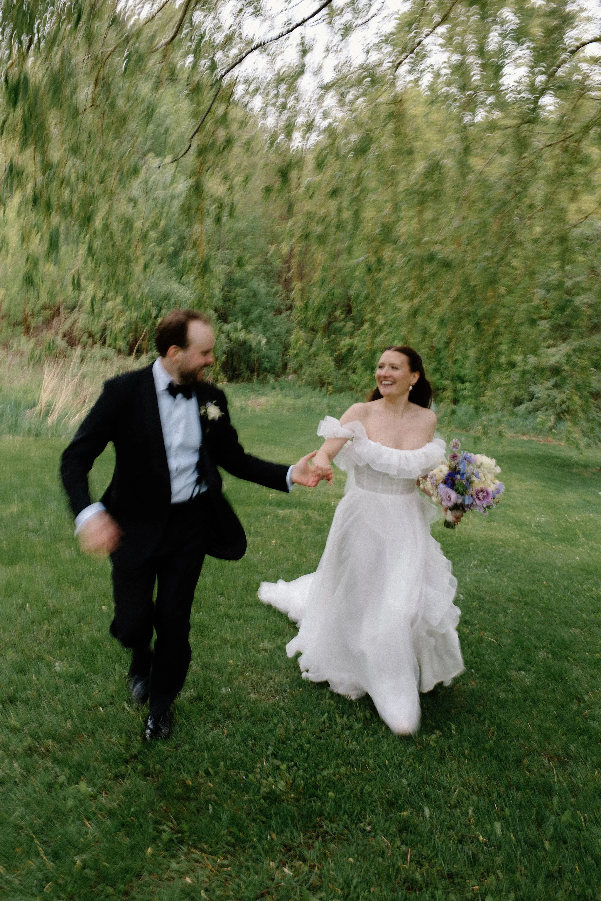  When the skies opened up for Lindsay and Matthew’s wedding at The Clearing, it didn't dampen the mood, instead, it set the stage for some of the most breathtaking portraits of the season. Working seamlessly with the overcast, dramatic lighting,  Joe