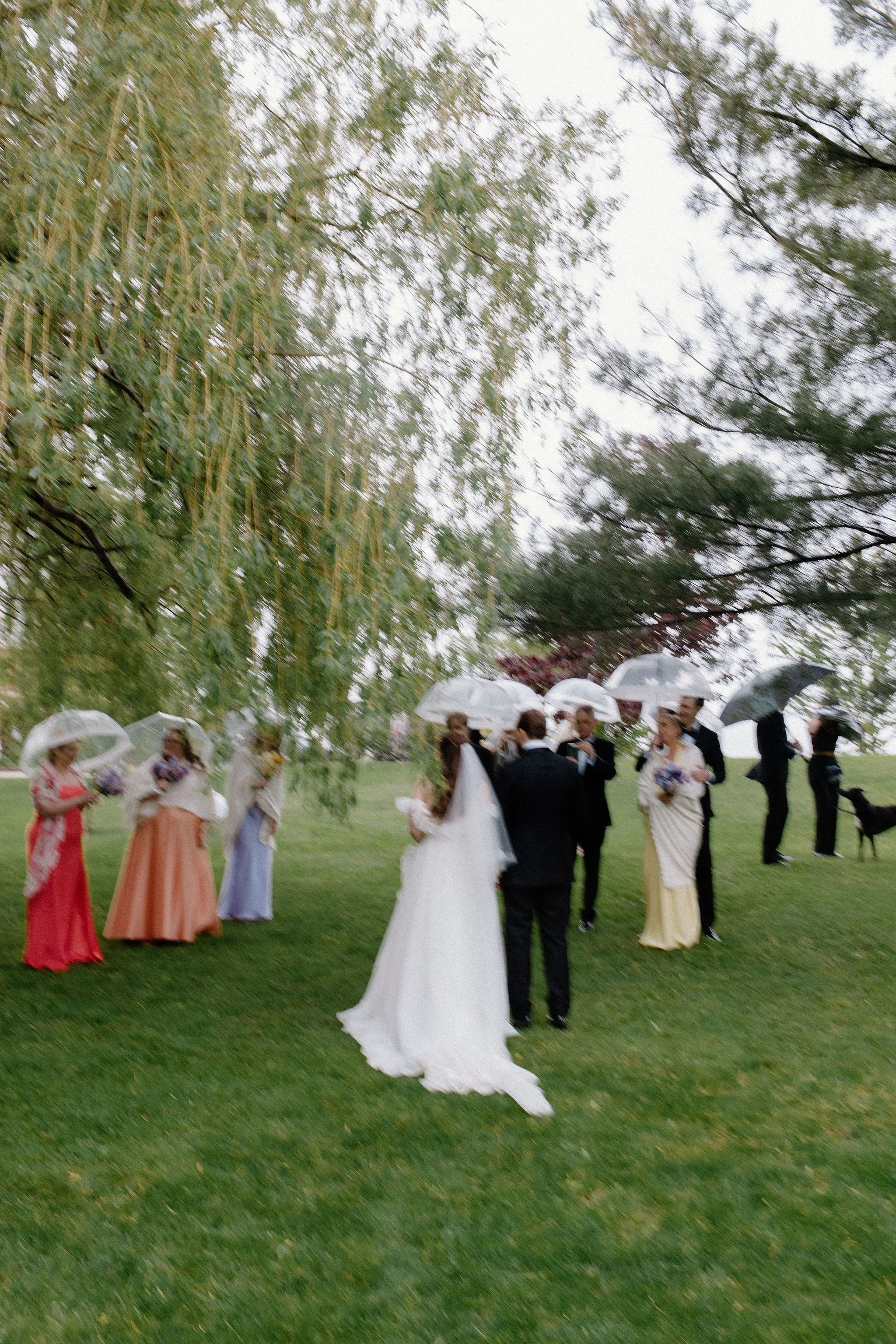  When the skies opened up for Lindsay and Matthew’s wedding at The Clearing, it didn't dampen the mood, instead, it set the stage for some of the most breathtaking portraits of the season. Working seamlessly with the overcast, dramatic lighting,  Joe