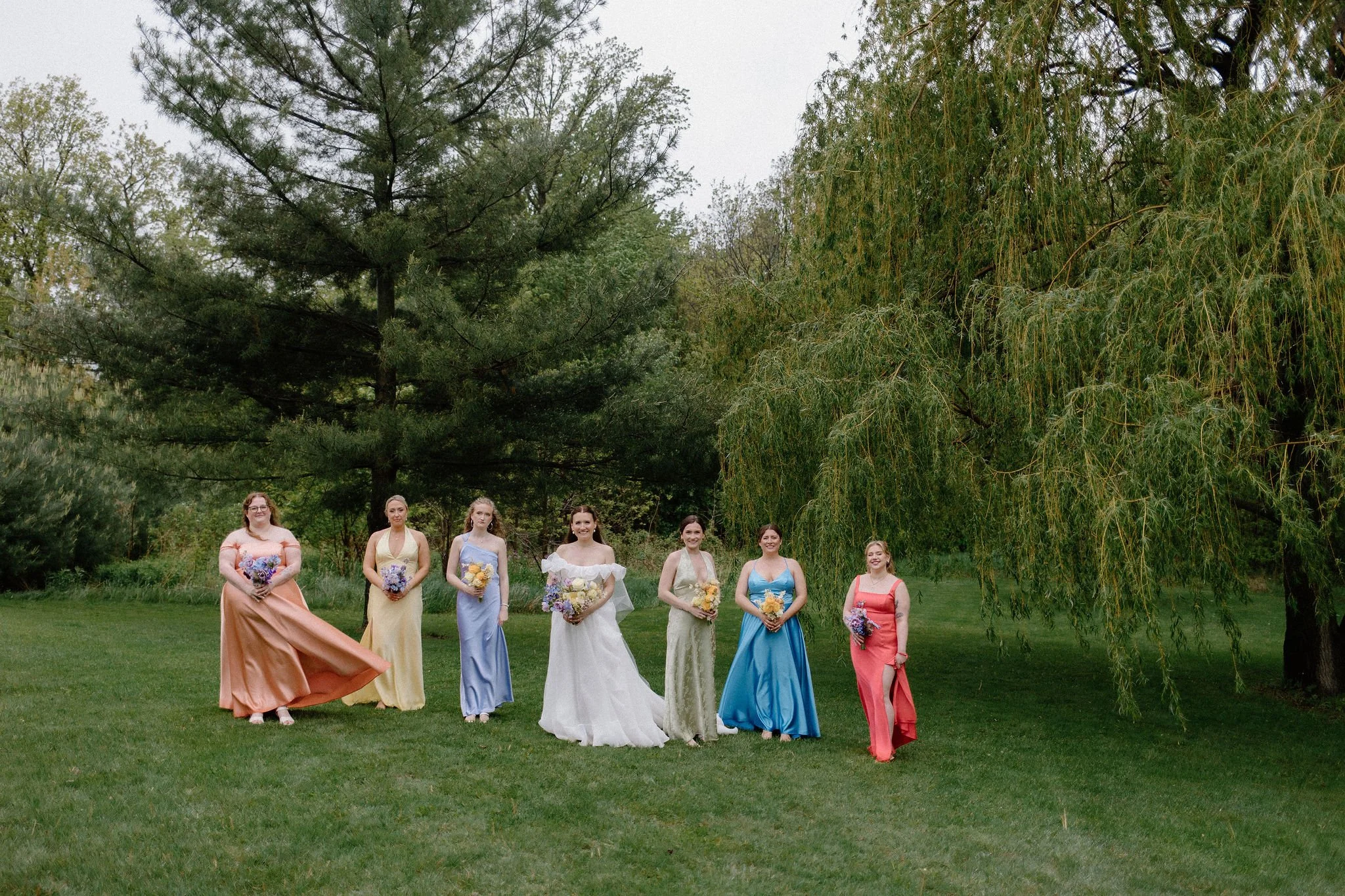  When the skies opened up for Lindsay and Matthew’s wedding at The Clearing, it didn't dampen the mood, instead, it set the stage for some of the most breathtaking portraits of the season. Working seamlessly with the overcast, dramatic lighting,  Joe