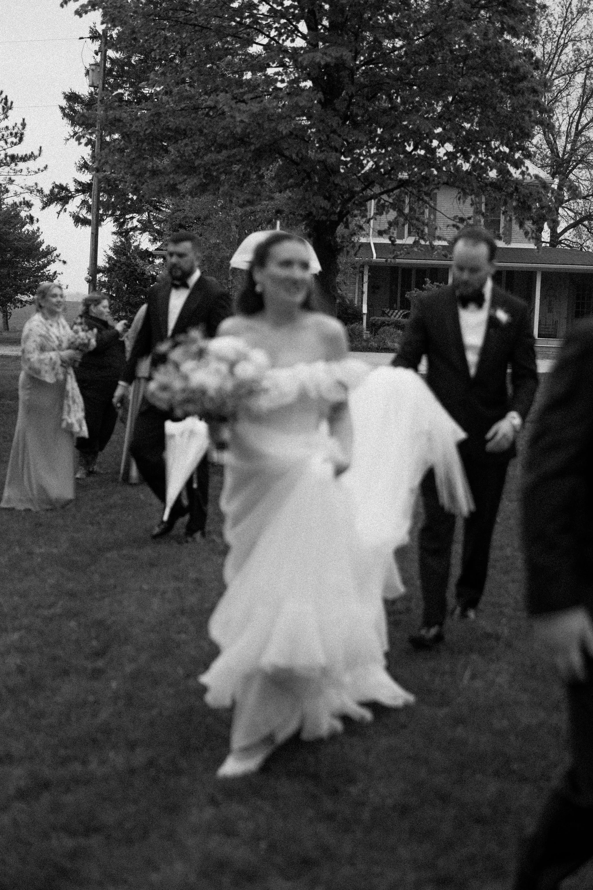  When the skies opened up for Lindsay and Matthew’s wedding at The Clearing, it didn't dampen the mood, instead, it set the stage for some of the most breathtaking portraits of the season. Working seamlessly with the overcast, dramatic lighting,  Joe