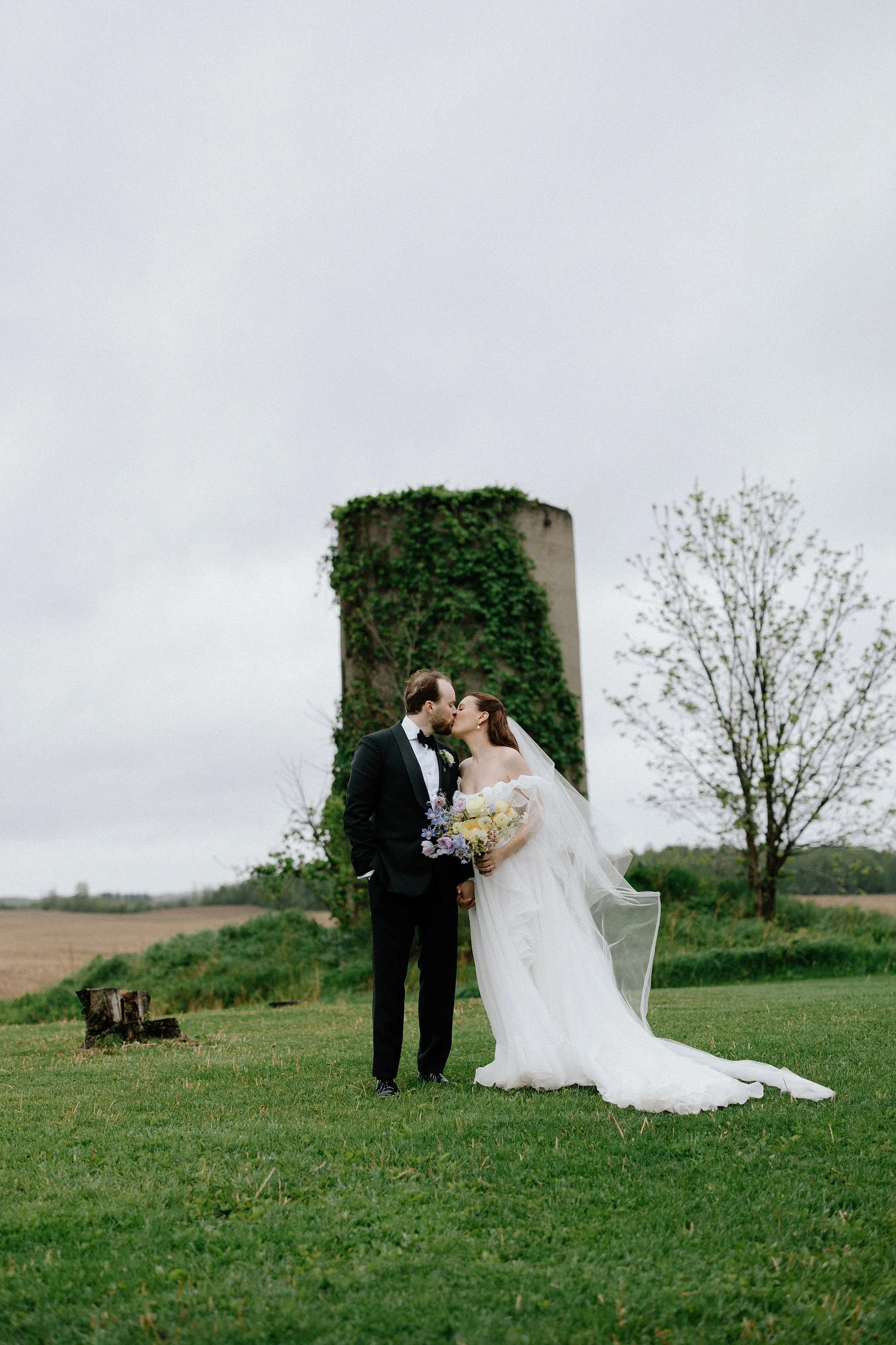  When the skies opened up for Lindsay and Matthew’s wedding at The Clearing, it didn't dampen the mood, instead, it set the stage for some of the most breathtaking portraits of the season. Working seamlessly with the overcast, dramatic lighting,  Joe