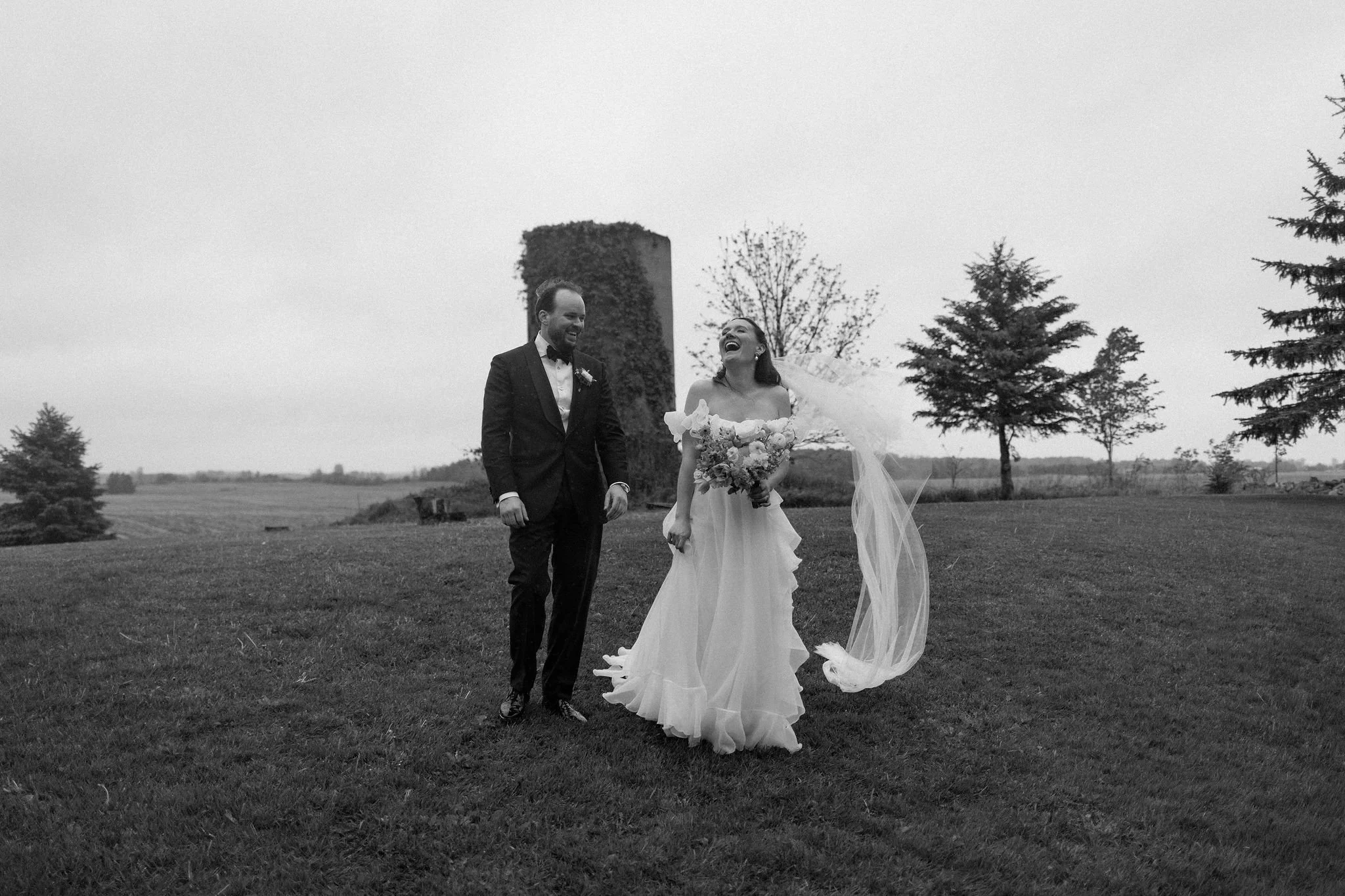  Who says rain has to dampen your wedding day aesthetic? L+M didn’t let a few showers stop them from having the whimsical garden wedding of their dreams at The Clearing. In fact, the moody, overcast light made their vibrant yellow and purple color pa