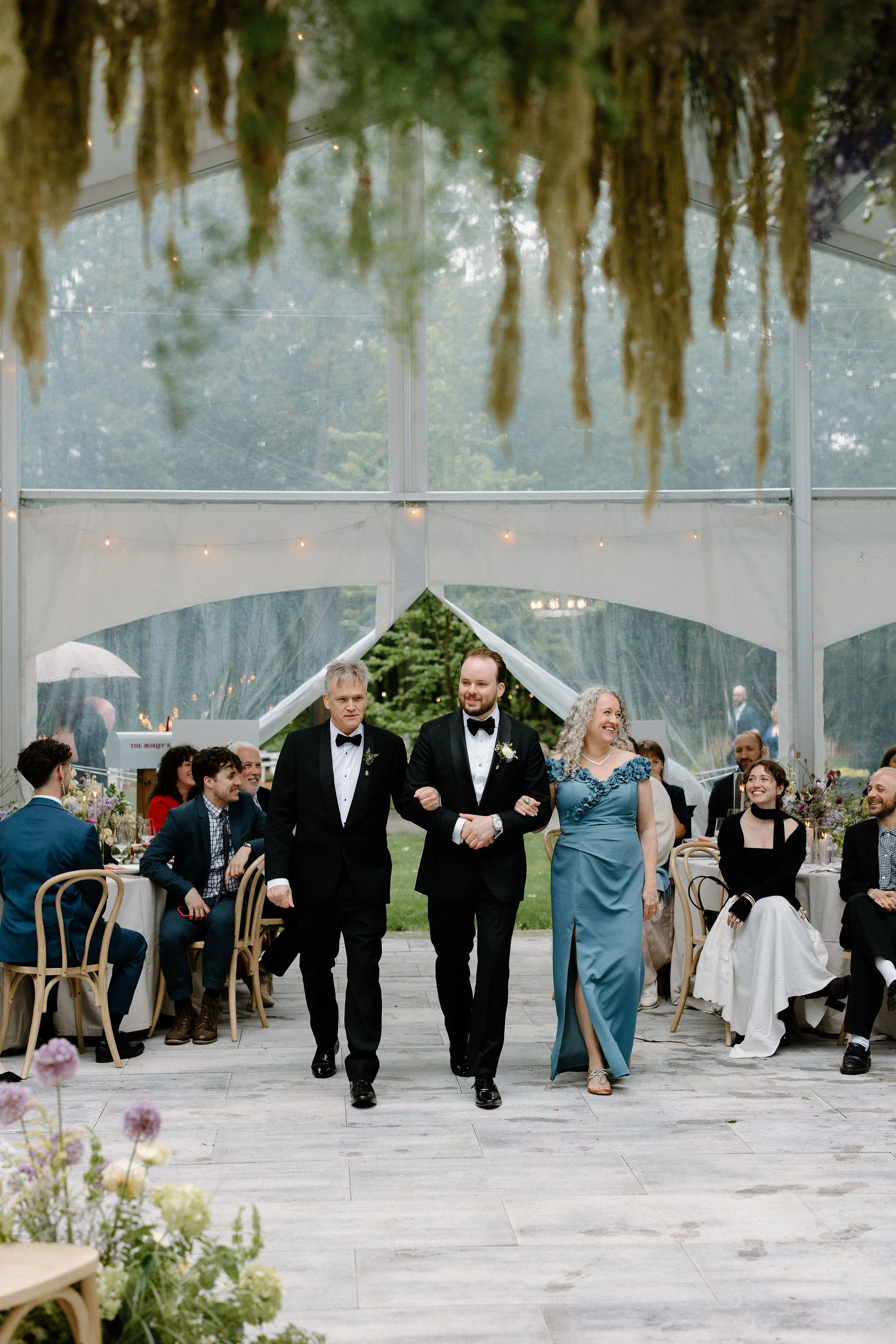  Groom walks up the aisle in the tent at The Clearing. 