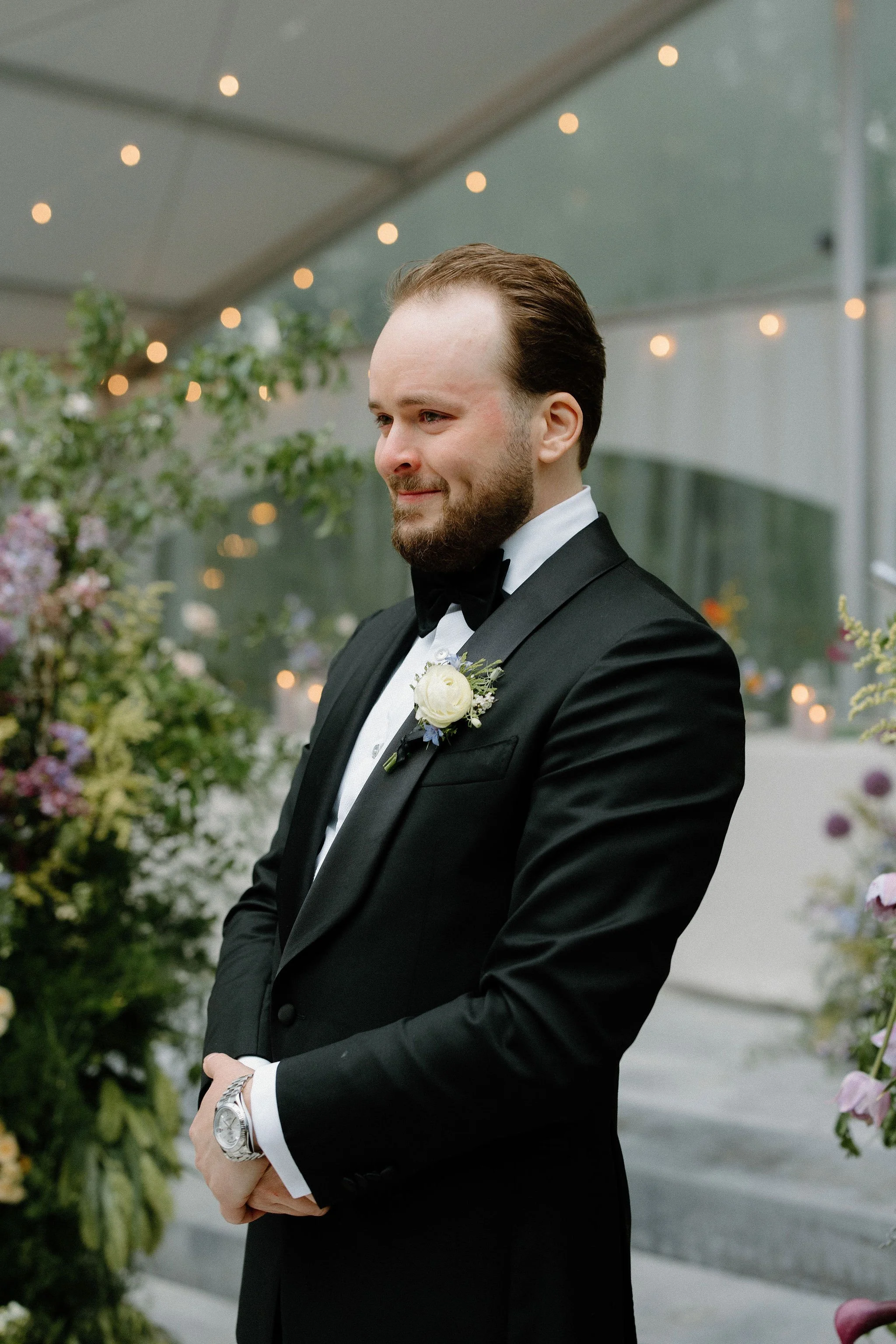  For L+M’s wedding at The Clearing, the floral design by  Forever Wildfield  was nothing short of a masterpiece. To bring a whimsical garden aesthetic inside the clear-top tent, the design team utilized layered, ground-level floral pillars at the alt