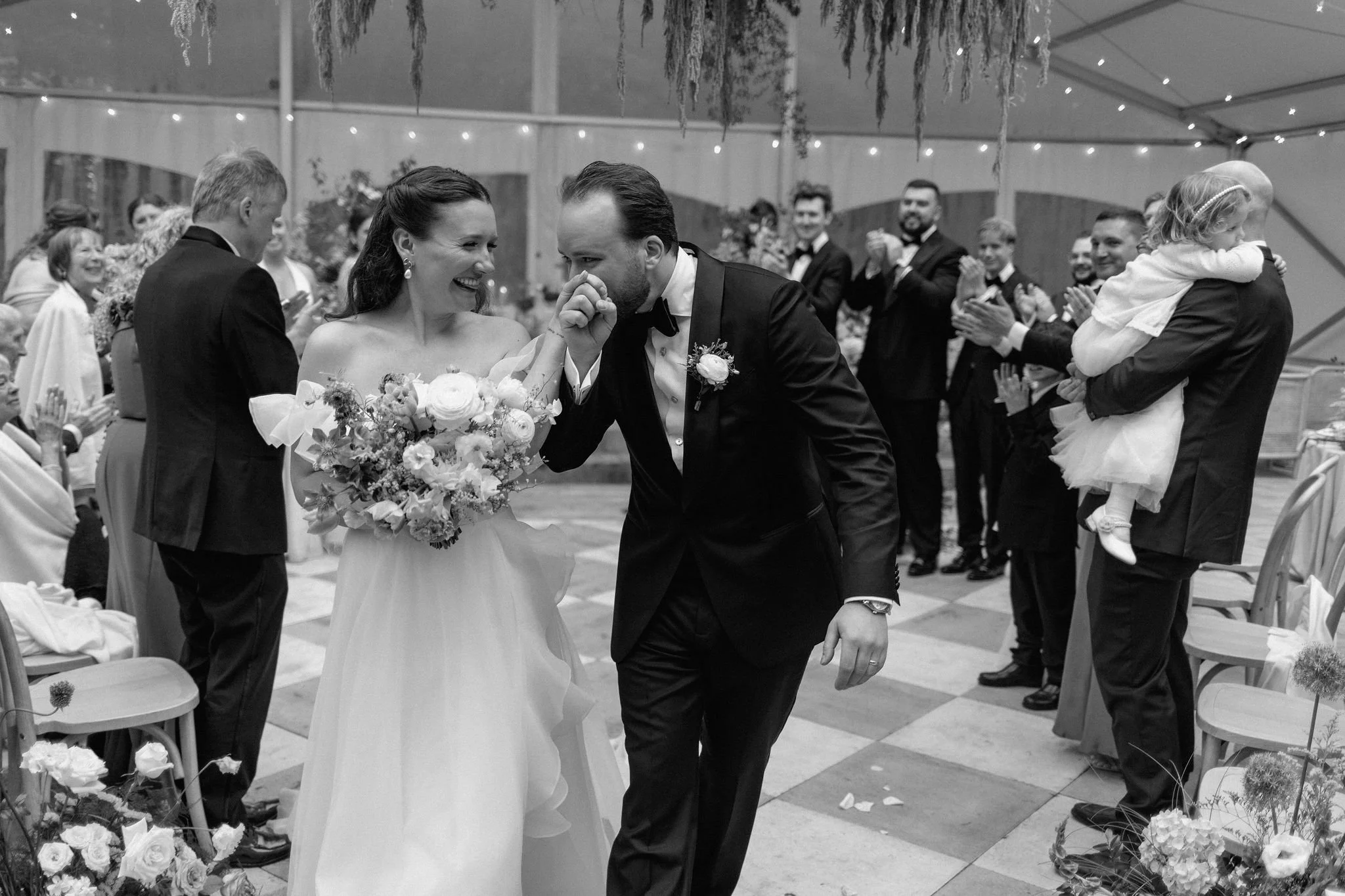  L+M’s wedding at The Clearing beautifully demonstrated how to embrace an outdoor rainy wedding day with absolute elegance. Moving their ceremony inside the venue's clear-top tent created an incredibly intimate and romantic atmosphere.  The space was