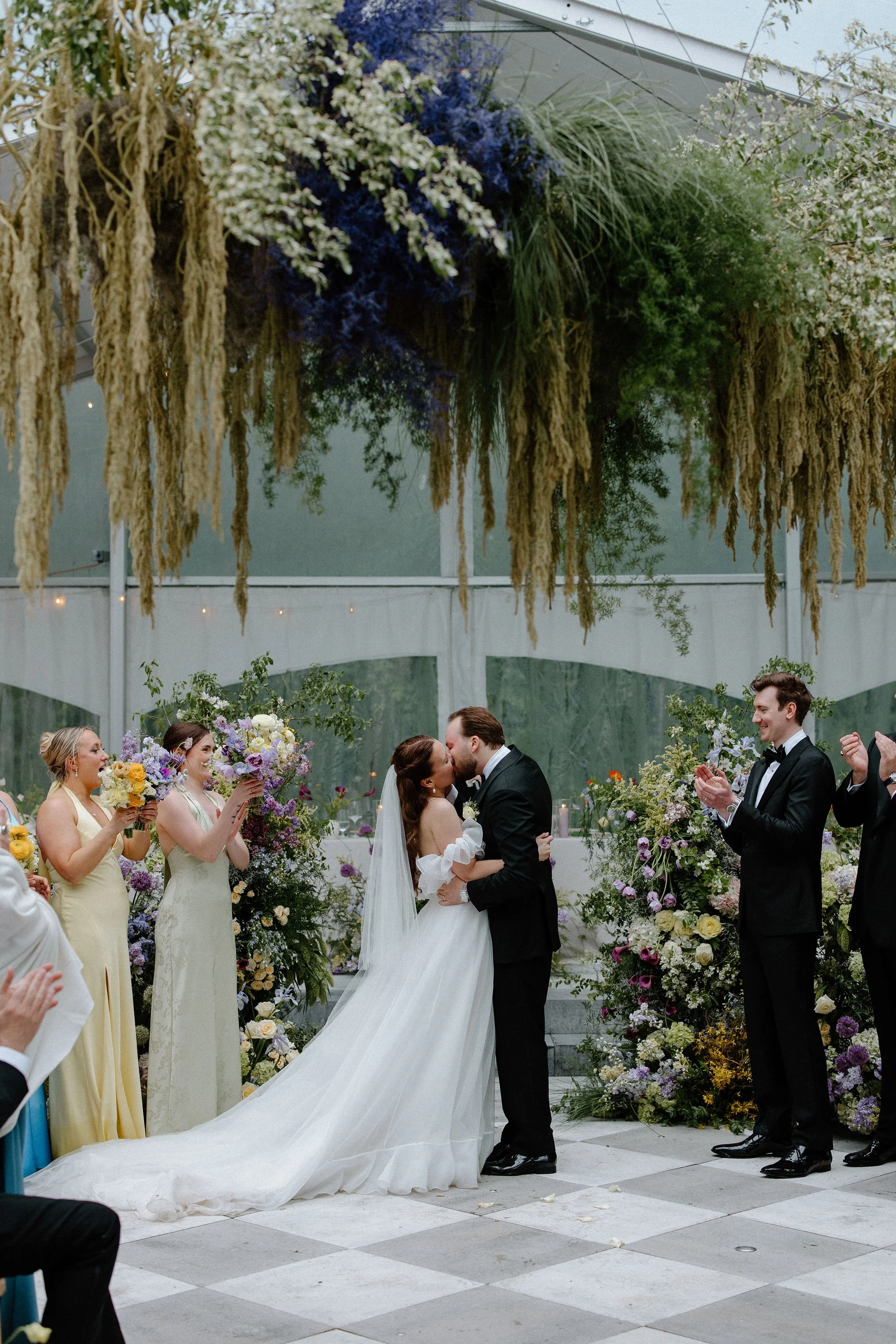  L+M’s wedding at The Clearing beautifully demonstrated how to embrace an outdoor rainy wedding day with absolute elegance. Moving their ceremony inside the venue's clear-top tent created an incredibly intimate and romantic atmosphere.  The space was