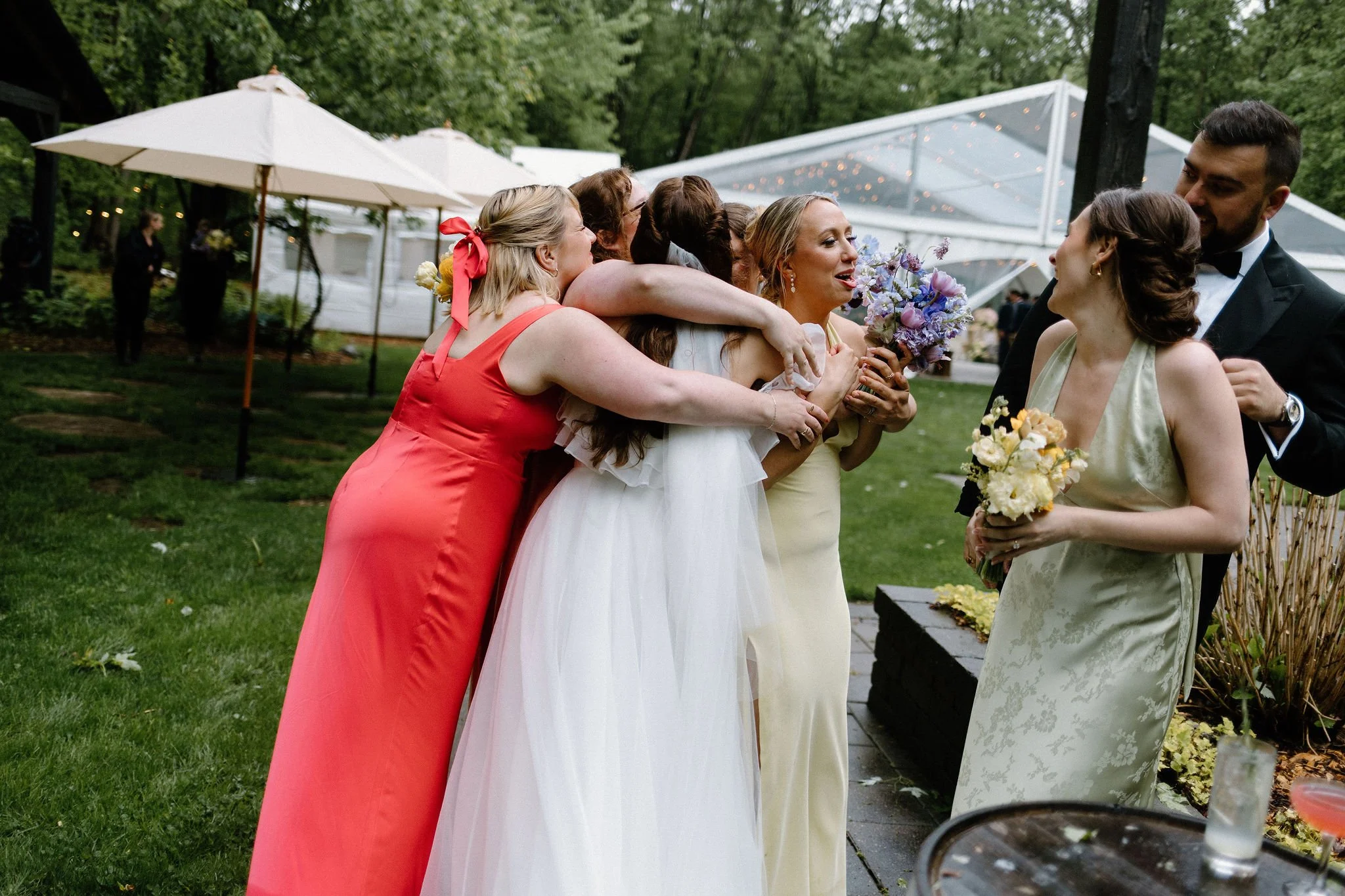  Step into this enchanting, rainy-day wedding gallery captured at The Clearing. Designed with a whimsical garden aesthetic, this outdoor celebration features a striking yellow and purple colour palette that perfectly countered the rainy skies. Explor
