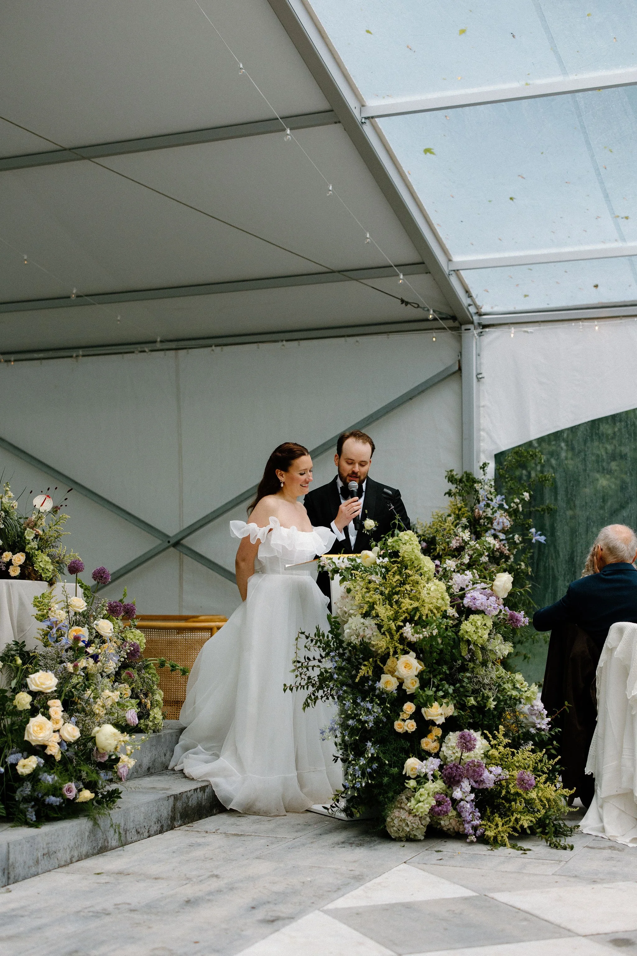  L+M’s wedding at The Clearing beautifully demonstrated how to embrace an outdoor rainy wedding day with absolute elegance. Moving their ceremony inside the venue's clear-top tent created an incredibly intimate and romantic atmosphere.  The space was