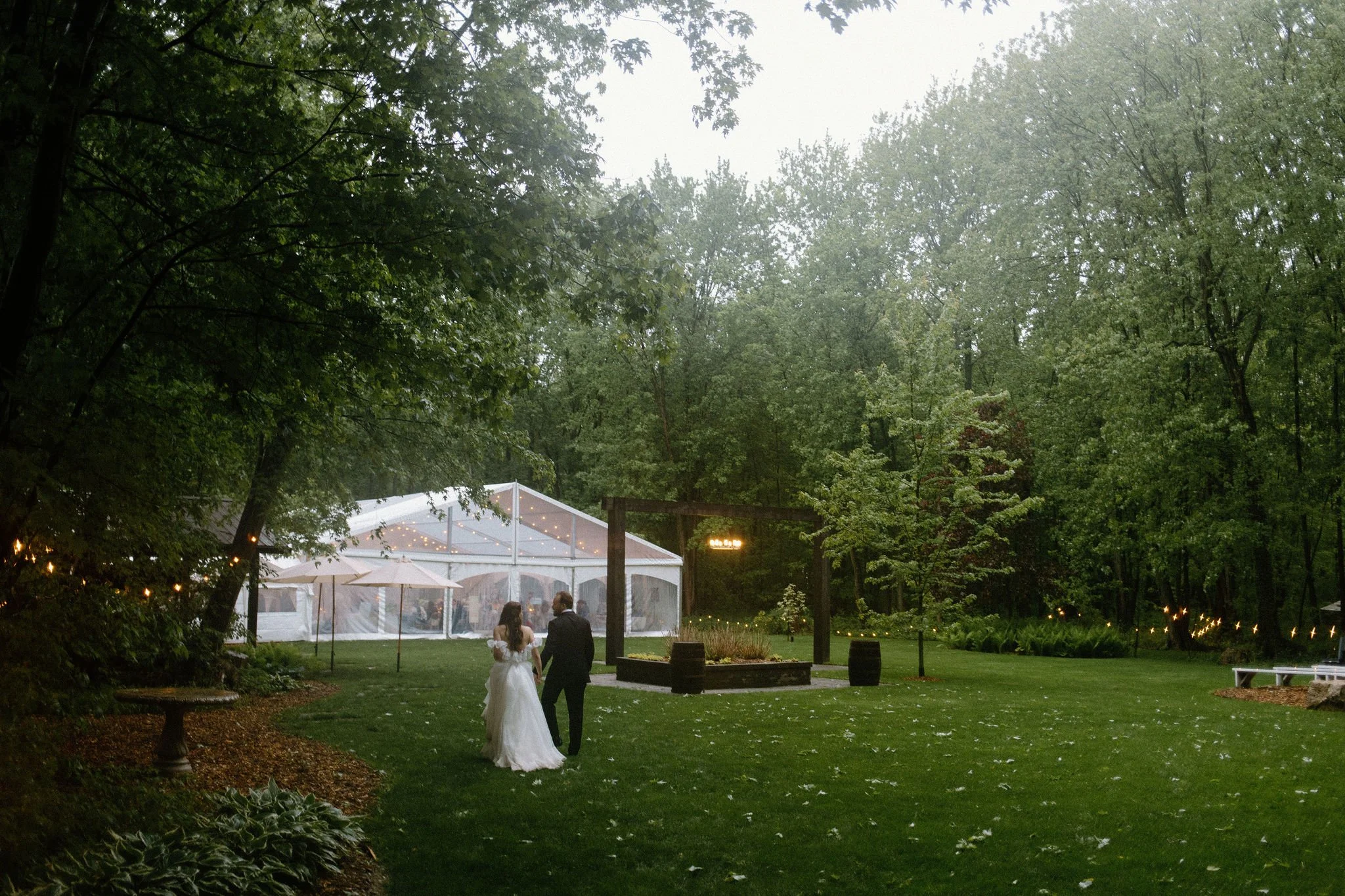  Proving that a little rain only adds to the romance, L+M’s wedding at The Clearing was an absolute dream. Nestled in the trees, this outdoor celebration embraced a whimsical garden aesthetic, brought to life by a vibrant, cheerful colour palette of 
