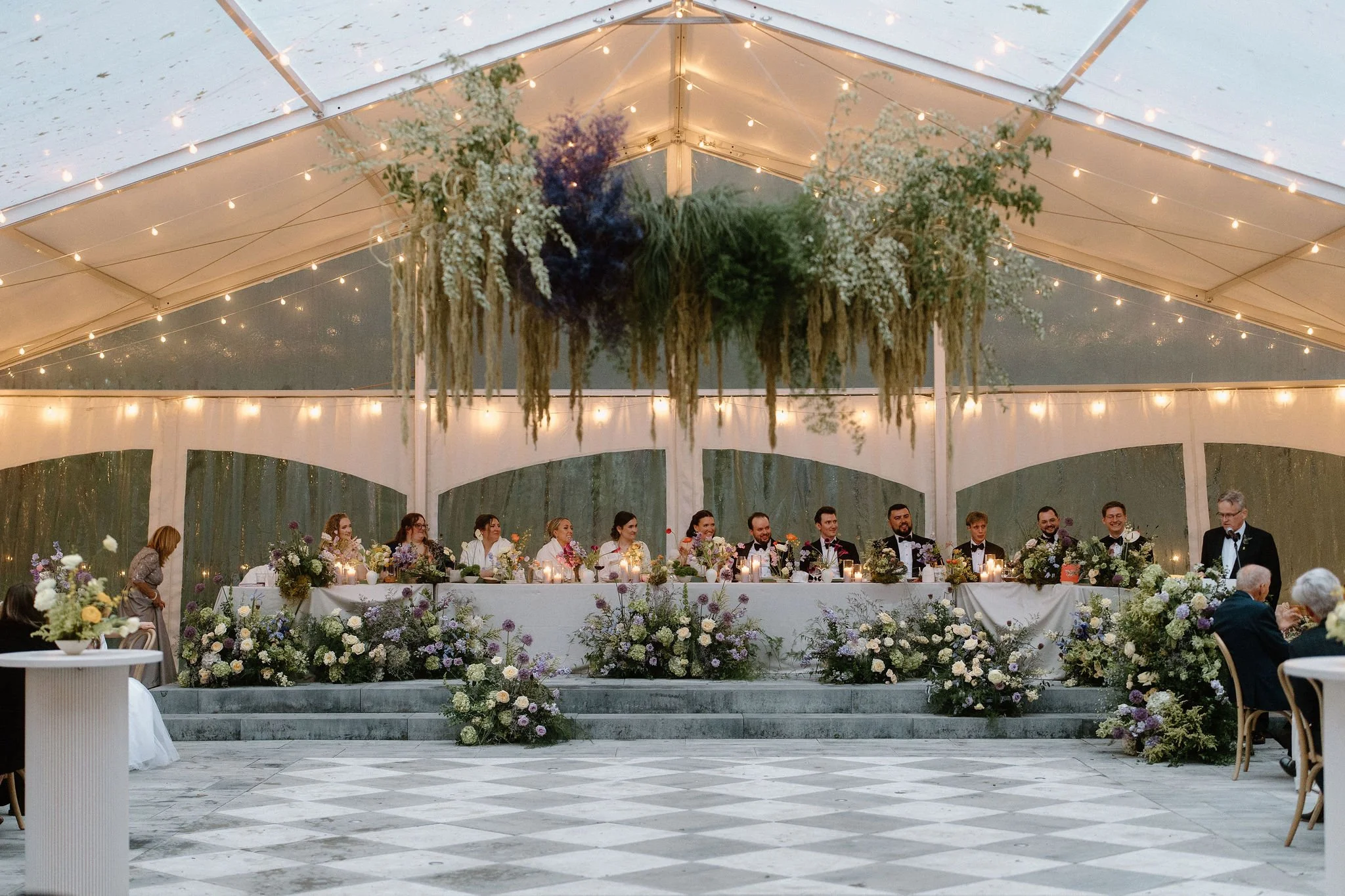  L+M’s wedding at The Clearing beautifully demonstrated how to embrace an outdoor rainy wedding day with absolute elegance. Moving their ceremony inside the venue's clear-top tent created an incredibly intimate and romantic atmosphere.  The space was