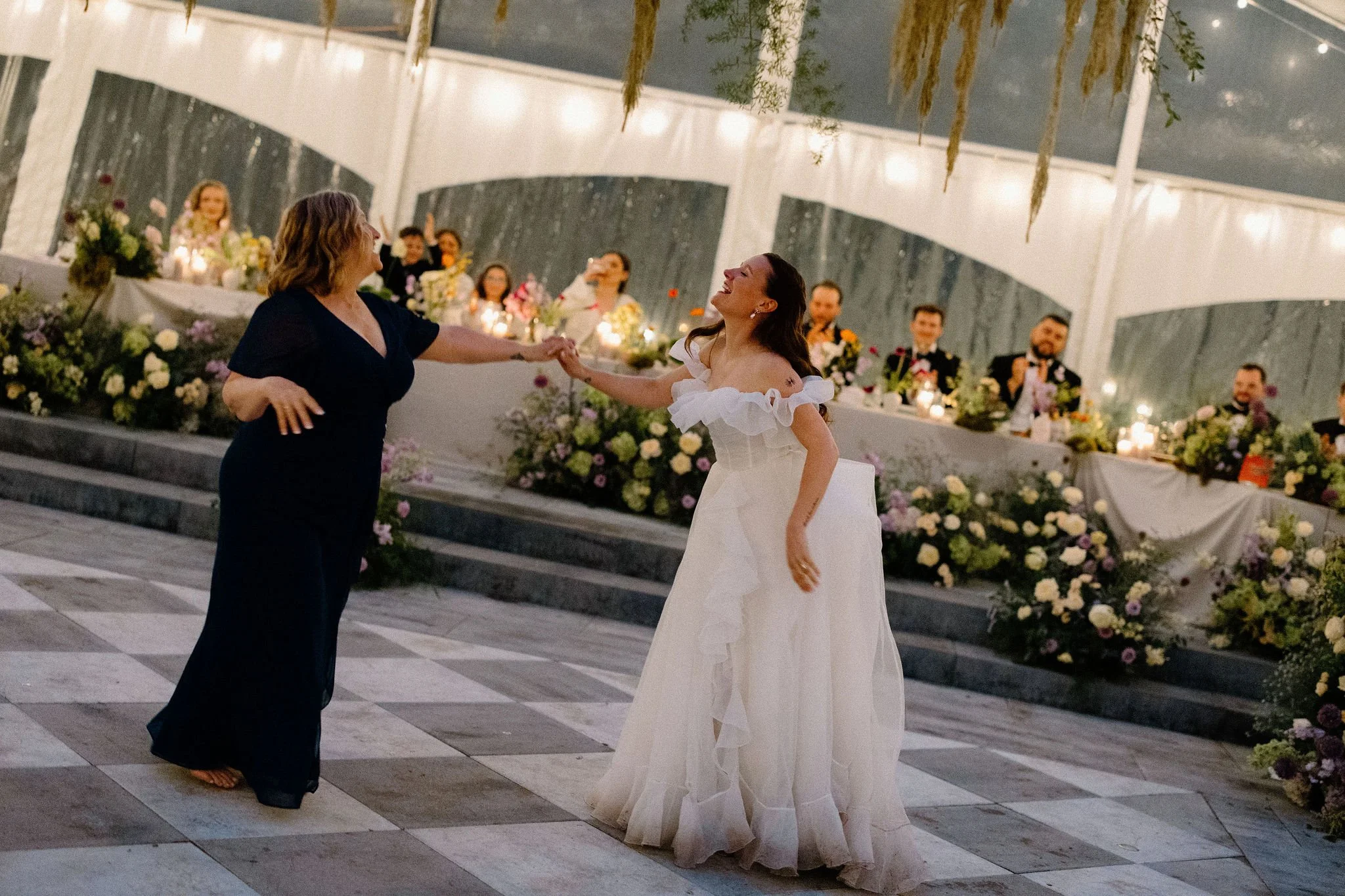  Bride of the Bride and Bride share a mother / daughter dance under the clear top tent at The Clearing to Mama Mia. 