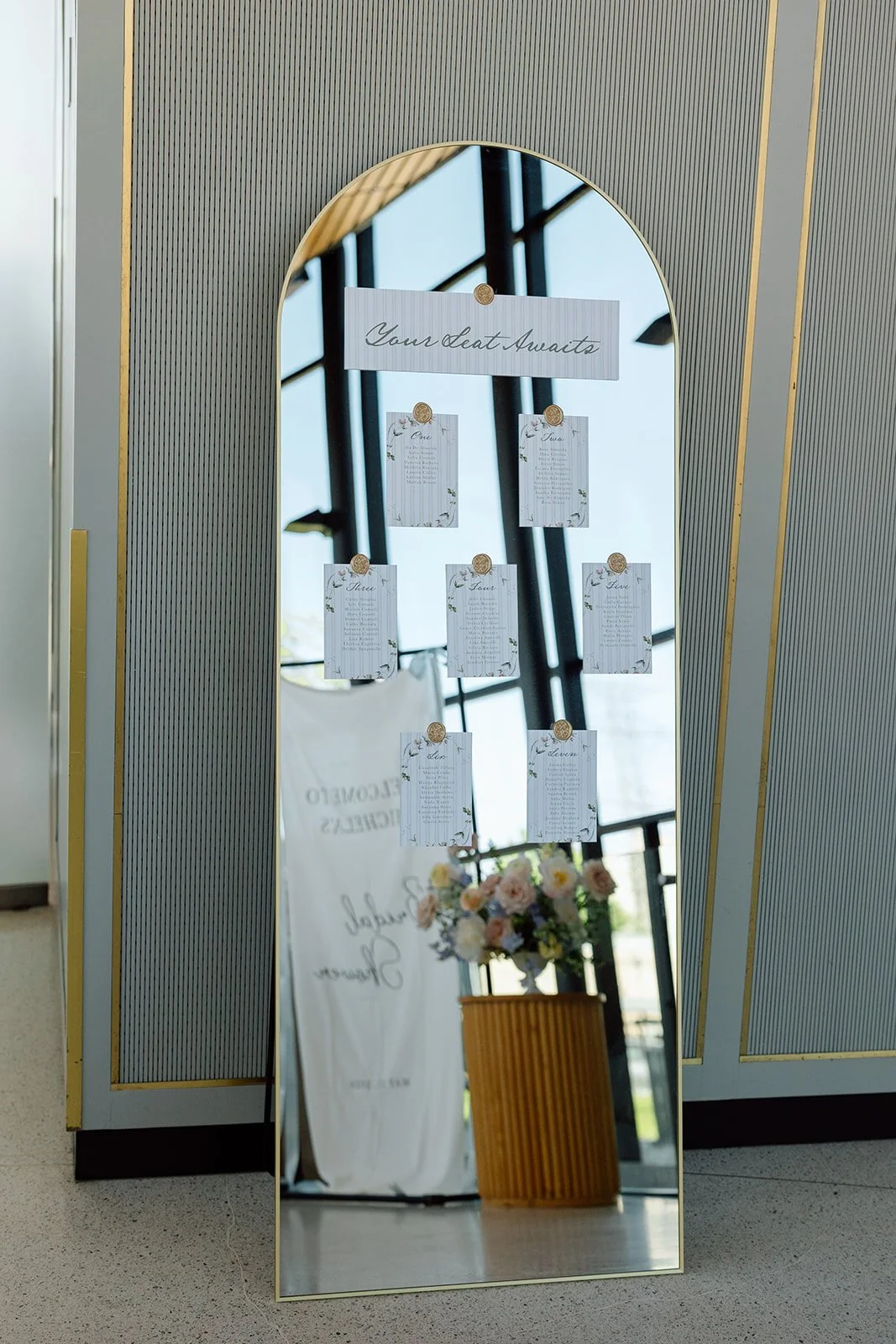  Custom mirror seating chart designed by All That’s Lovely. 