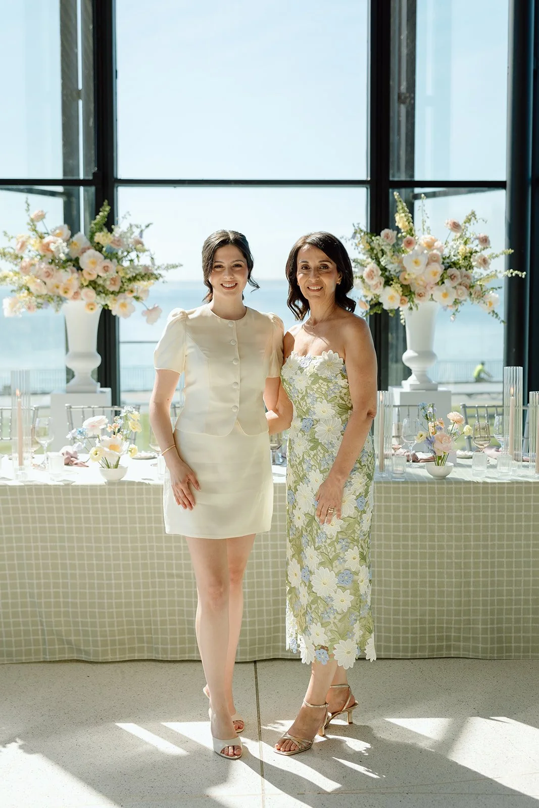 Bride and Mom share at moment to take in the curated shower design at Spencer’s on the Waterfront. Planning &amp; Design by Lindsay Plank Events. 