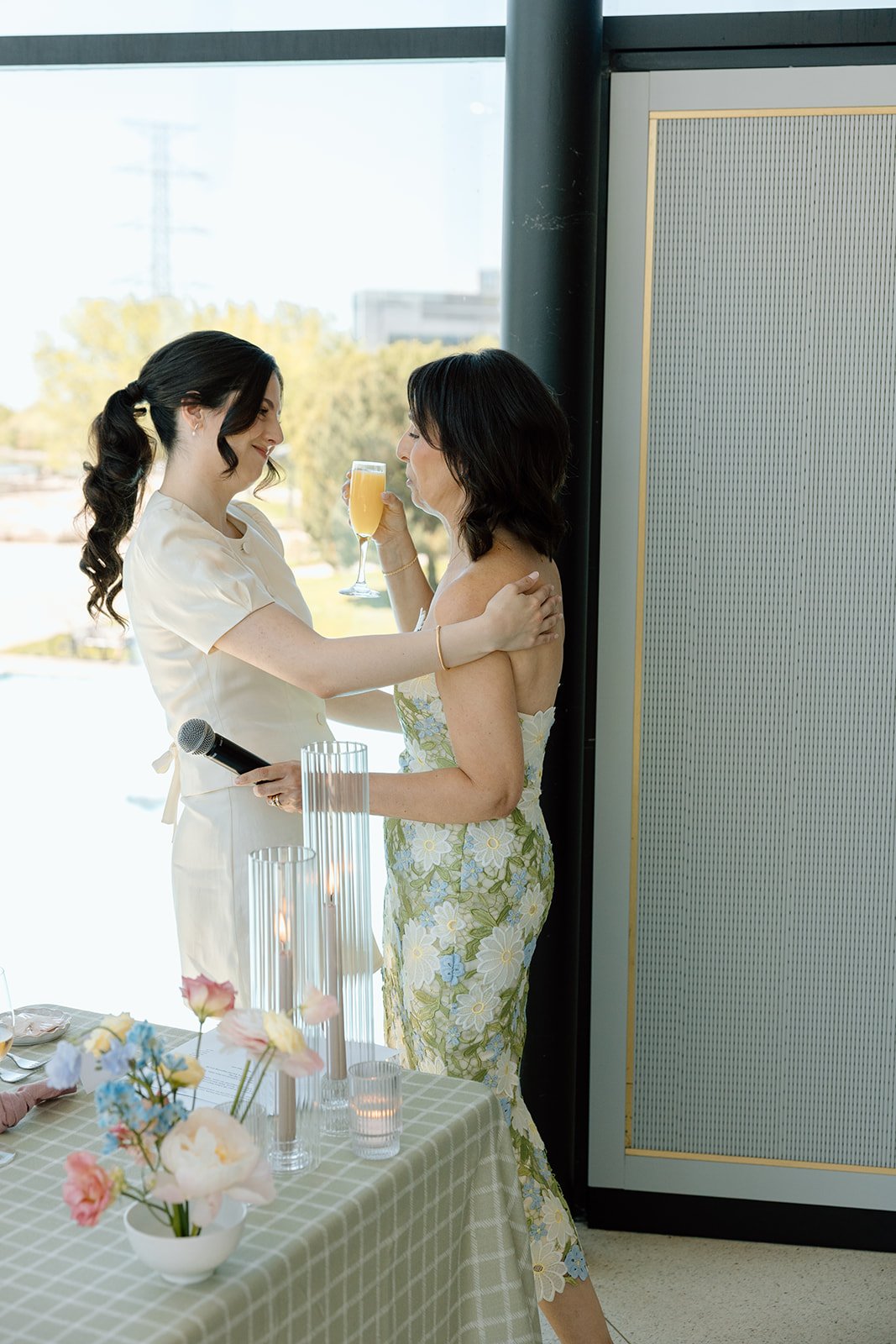  Hugs after thank you speech with bride and mother of the bride. Captured by Paula Visco Photography.  