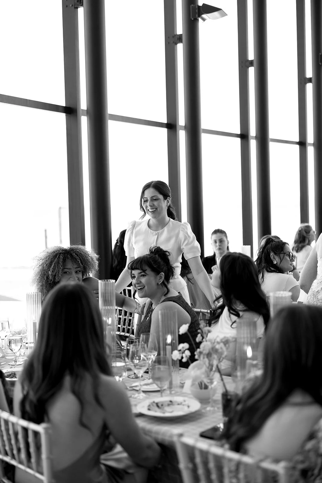  Bride chatting with her guests at the bridal shower hosted at Spencer’s on the Waterfront. 