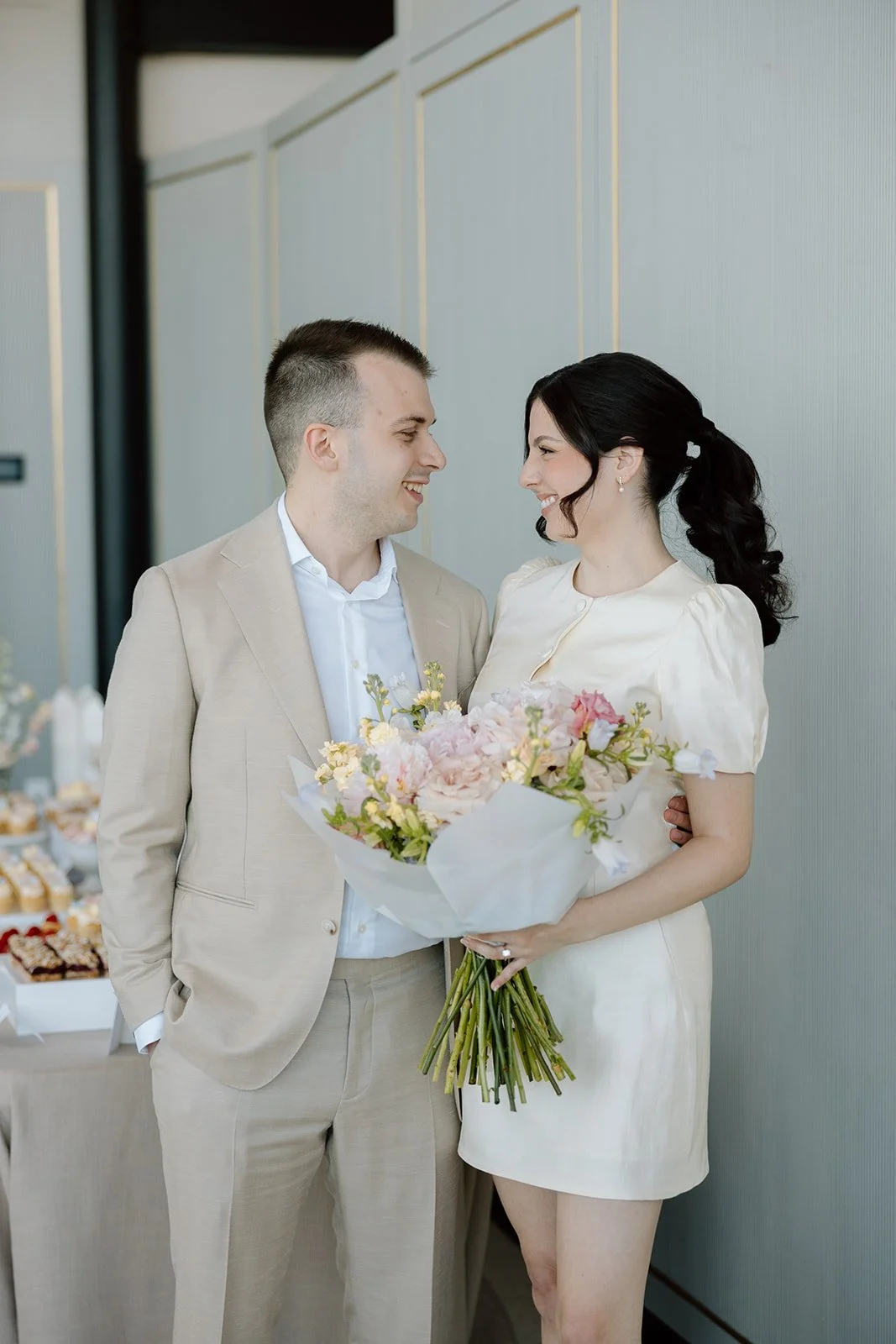  Bride and Groom enjoy a moment together while guests enjoy their dessert at Spencer’s on the Waterfront. 