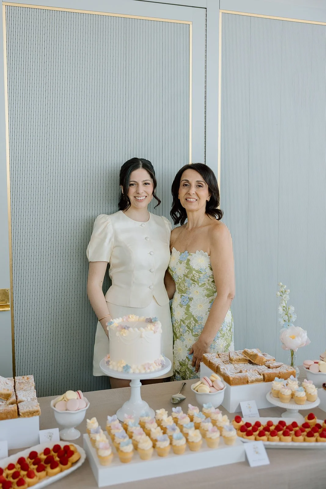  Instead of a traditional cake, guests indulged in a beautifully styled dessert bar featuring gourmet berry crumble bars and classic French macarons. 