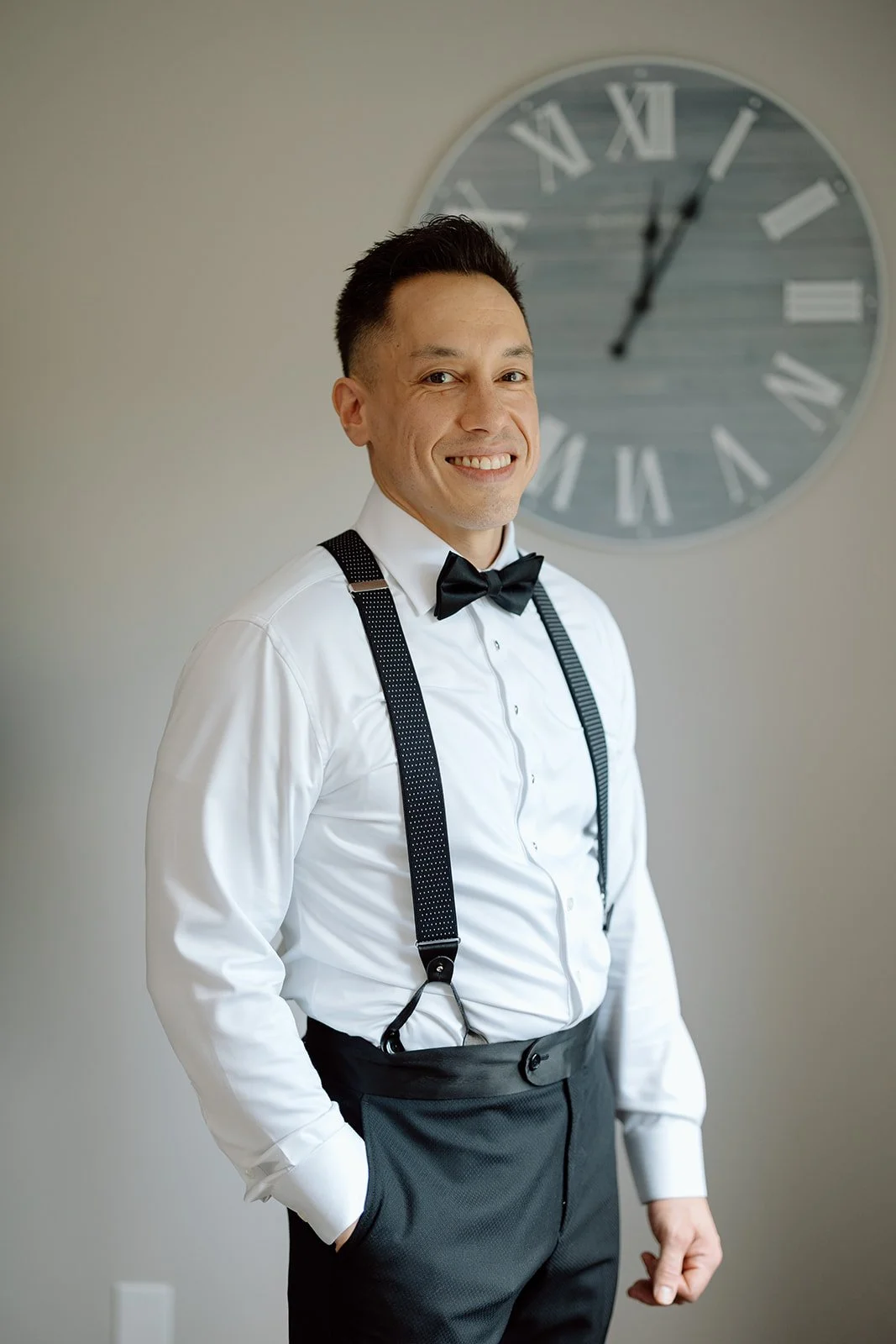 Groom getting ready prior to the First Look with his groomsmen and parents. 