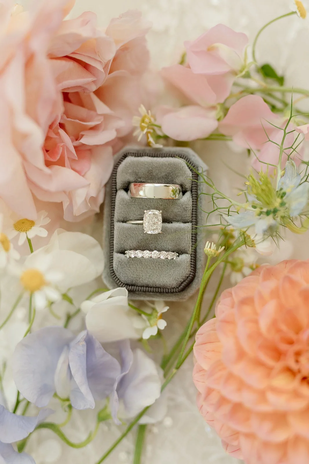  Custom made ring box hosting bride and groom’s wedding bands, in a bed for fresh florals in a summer colour palette. 